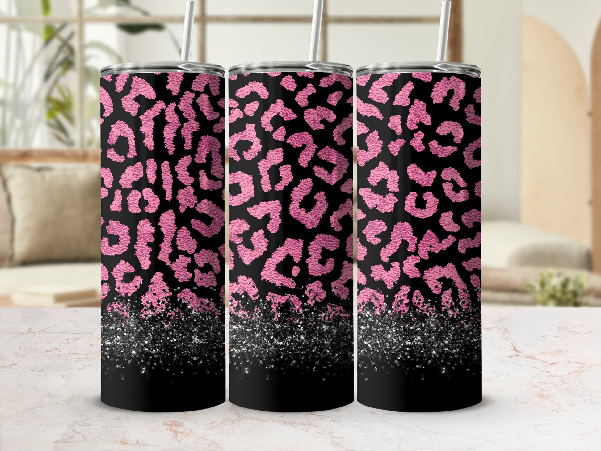 Three tumblers with a black and pink leopard print and glitter base.