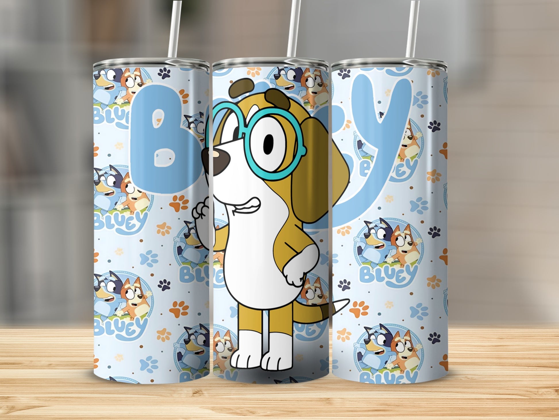 Bluey characters on a light blue patterned tumbler with straws.