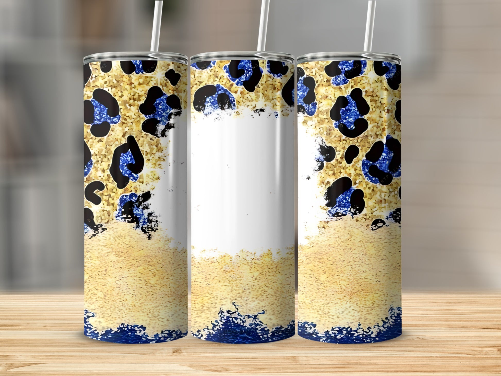 Three tumblers with blue glitter leopard print and gold textured design.