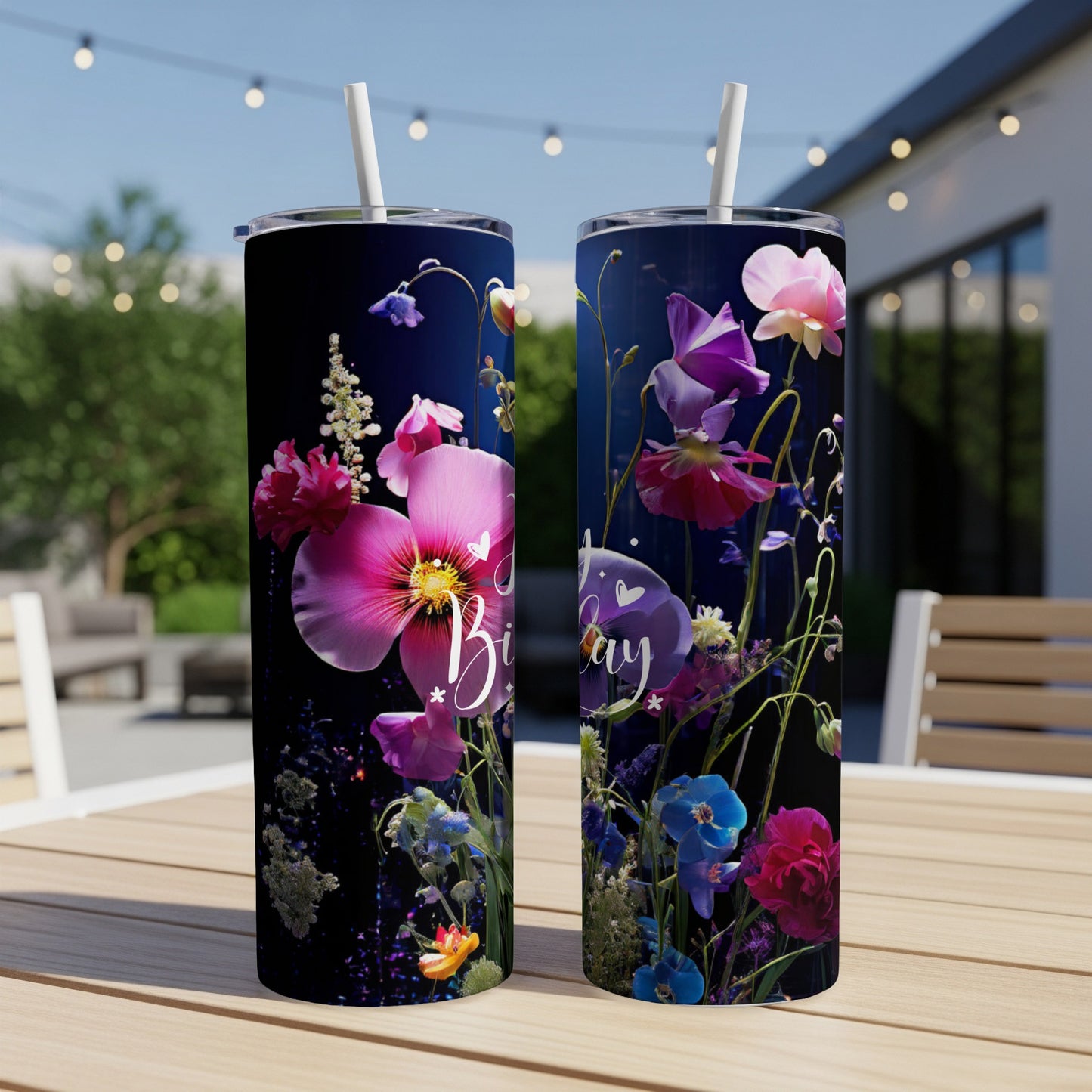 Two tumblers with floral designs and "Birthday" text, sitting on a table.