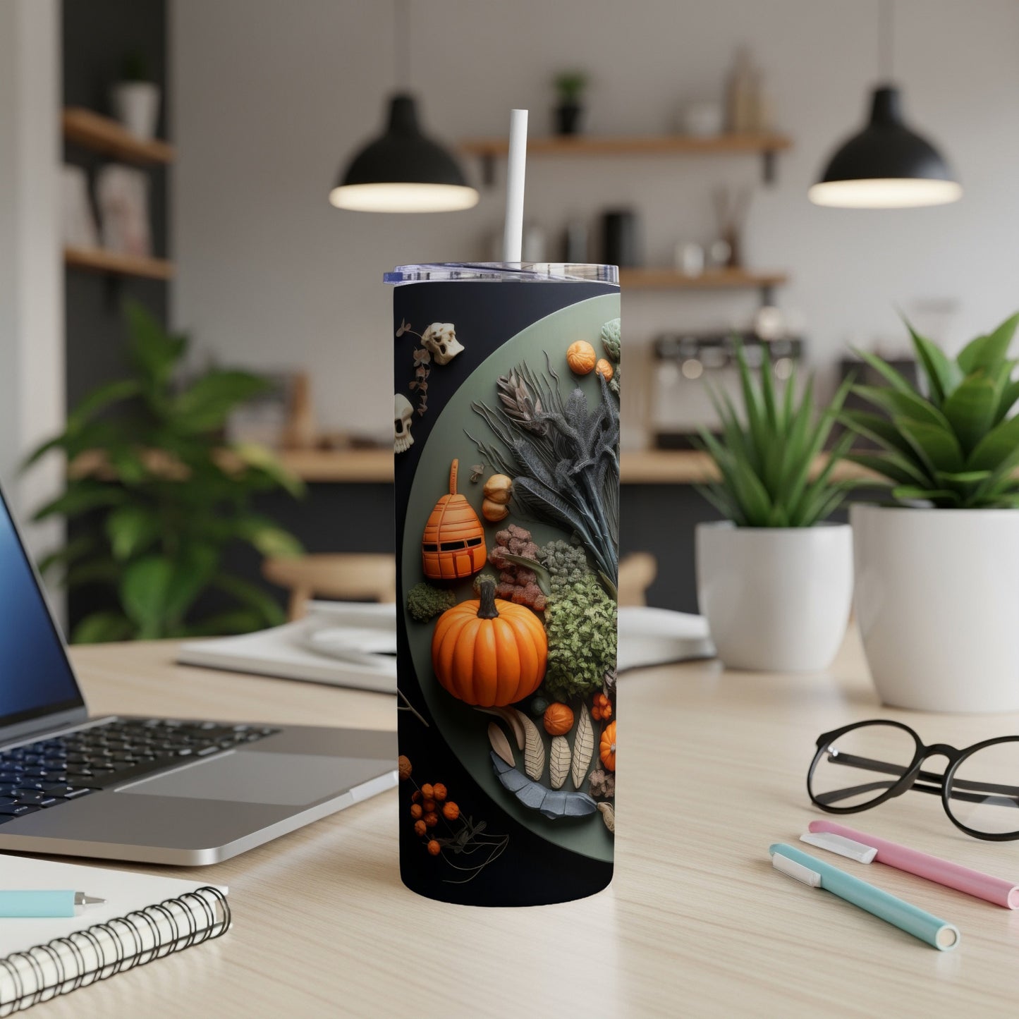 Tumbler with a Halloween harvest design featuring skulls, pumpkins, and dried foliage.
