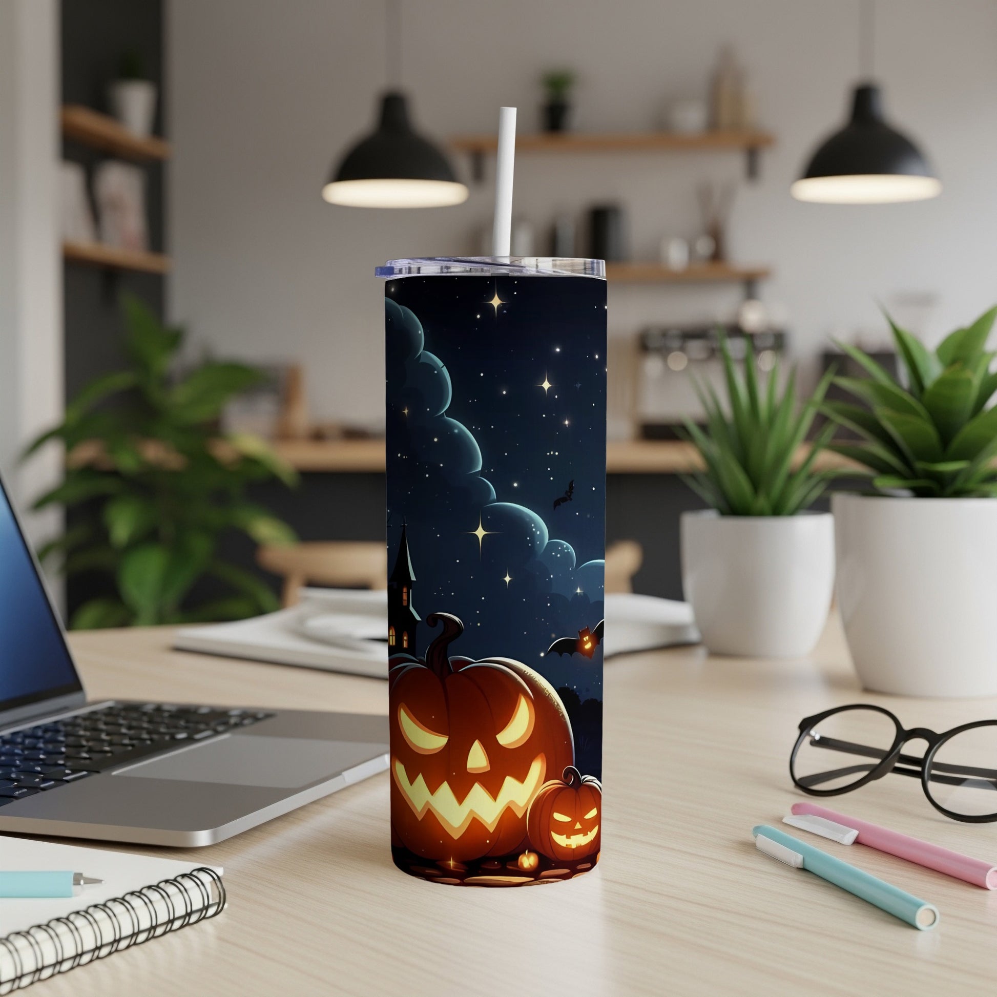 Tumbler with jack-o'-lanterns, bats, haunted castle, and starry night design.