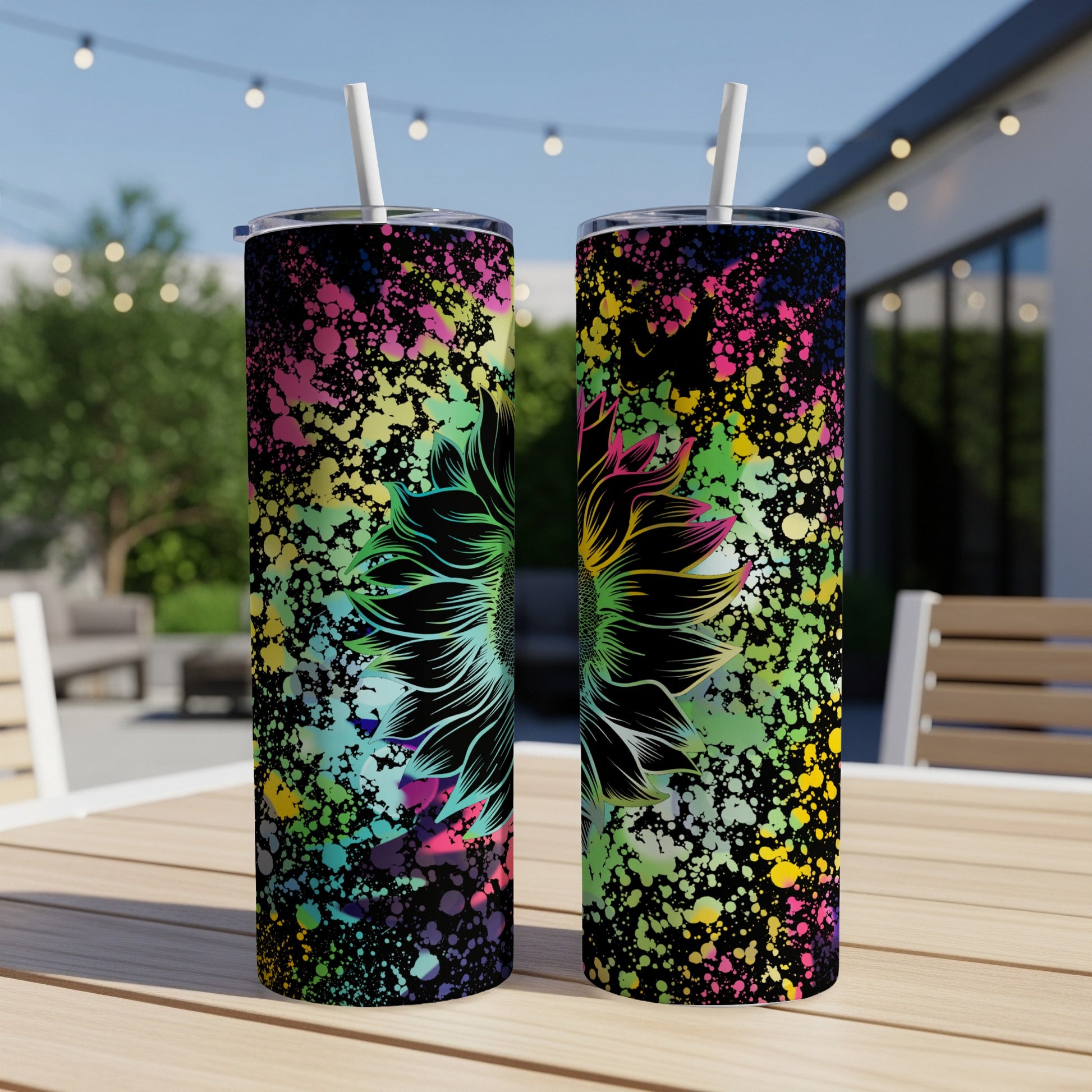 Two tumblers with black background and colorful splash art, featuring a black outlined sunflower.