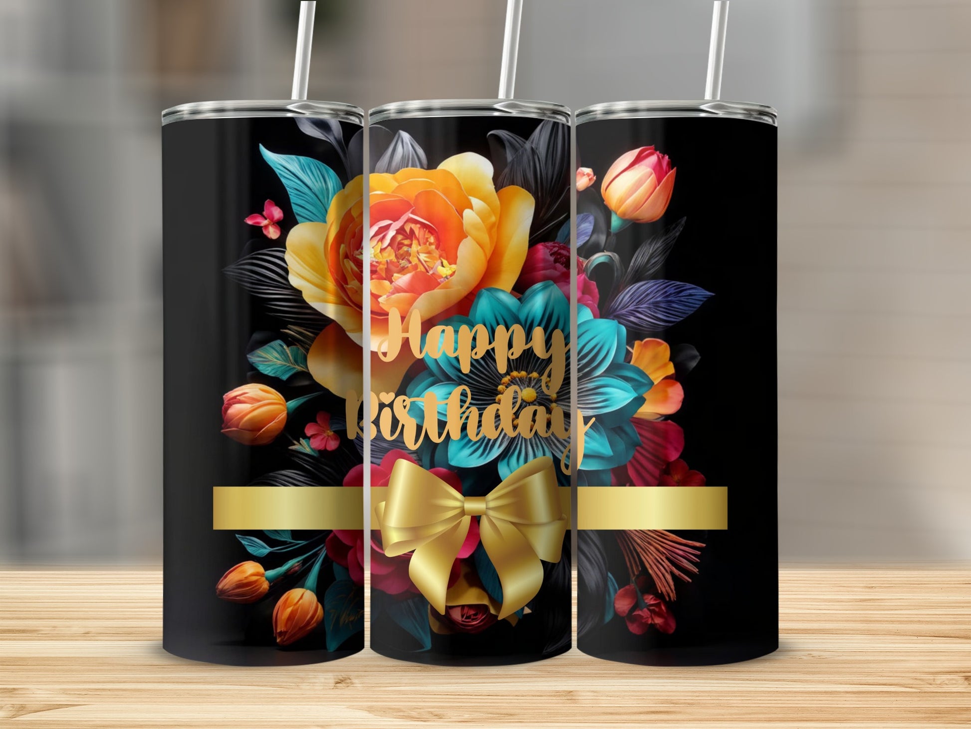 Black tumbler with "Happy Birthday" and floral design with gold ribbon.