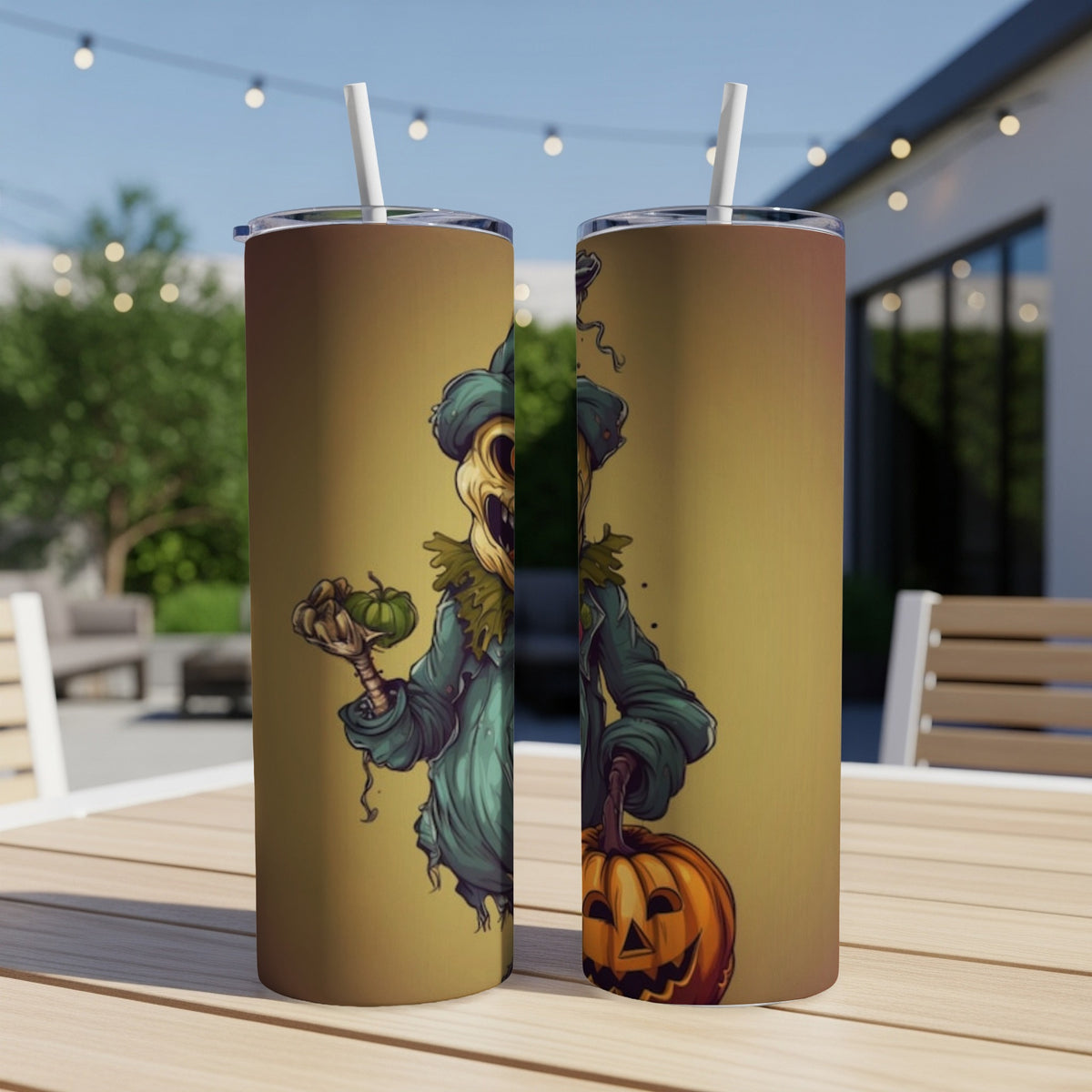 Two tumblers with a spooky scarecrow design, one holding a mini pumpkin, the other a jack-o'-lantern.