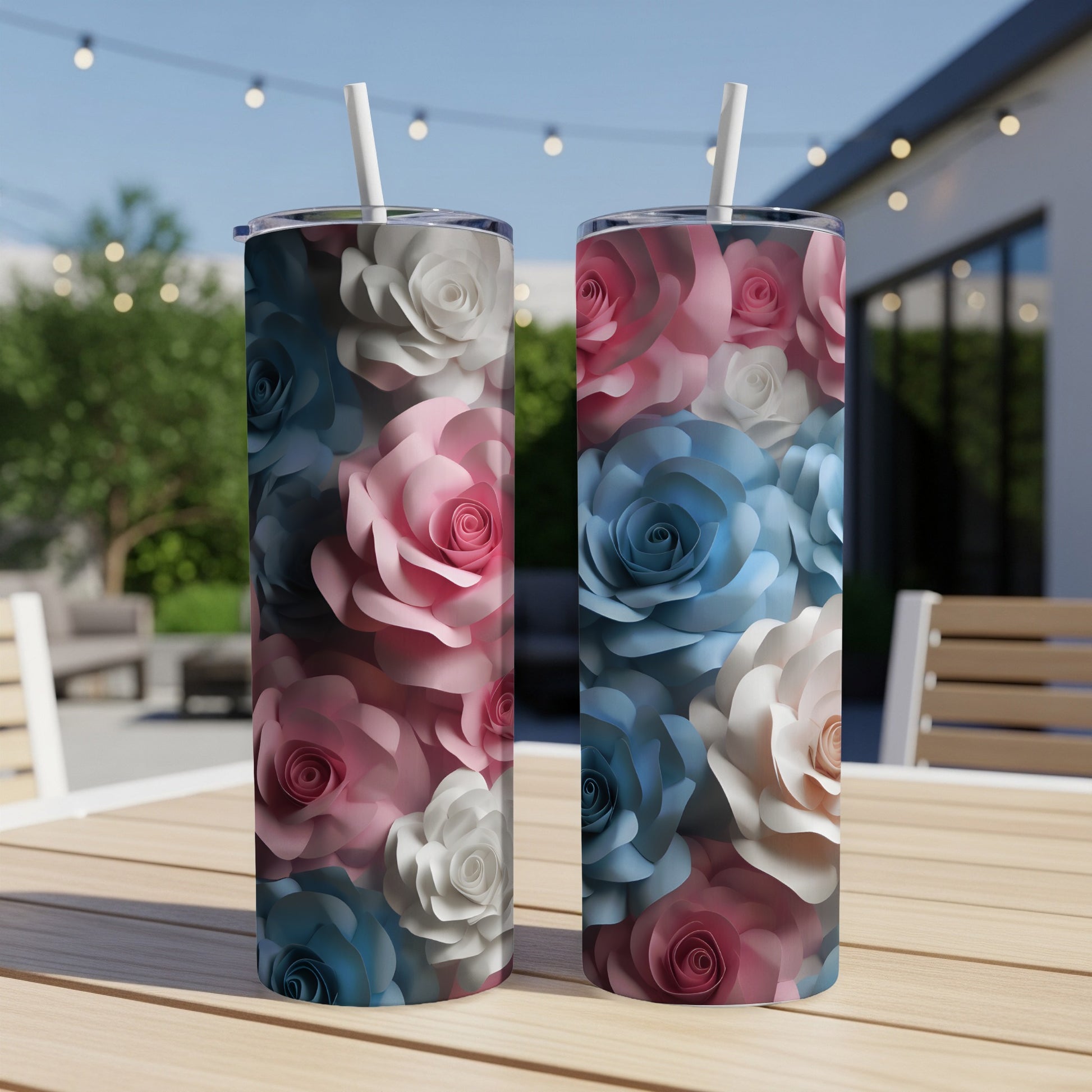 Two tumblers with a floral pattern of pink, blue, and white roses.