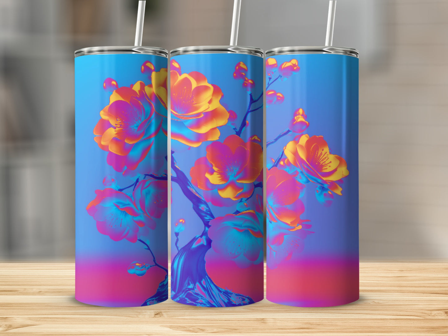 Three tumblers with a vibrant, abstract floral design on a blue and pink gradient background.