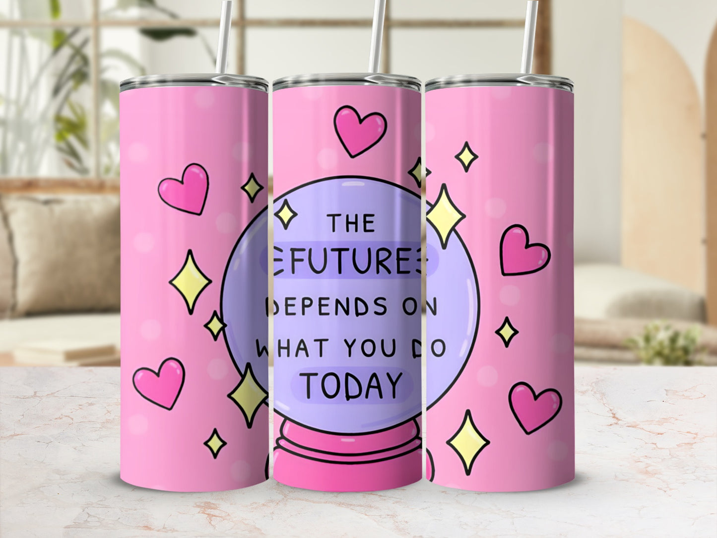 Pink tumbler with crystal ball, hearts, and stars, reading "The future depends on what you do today."