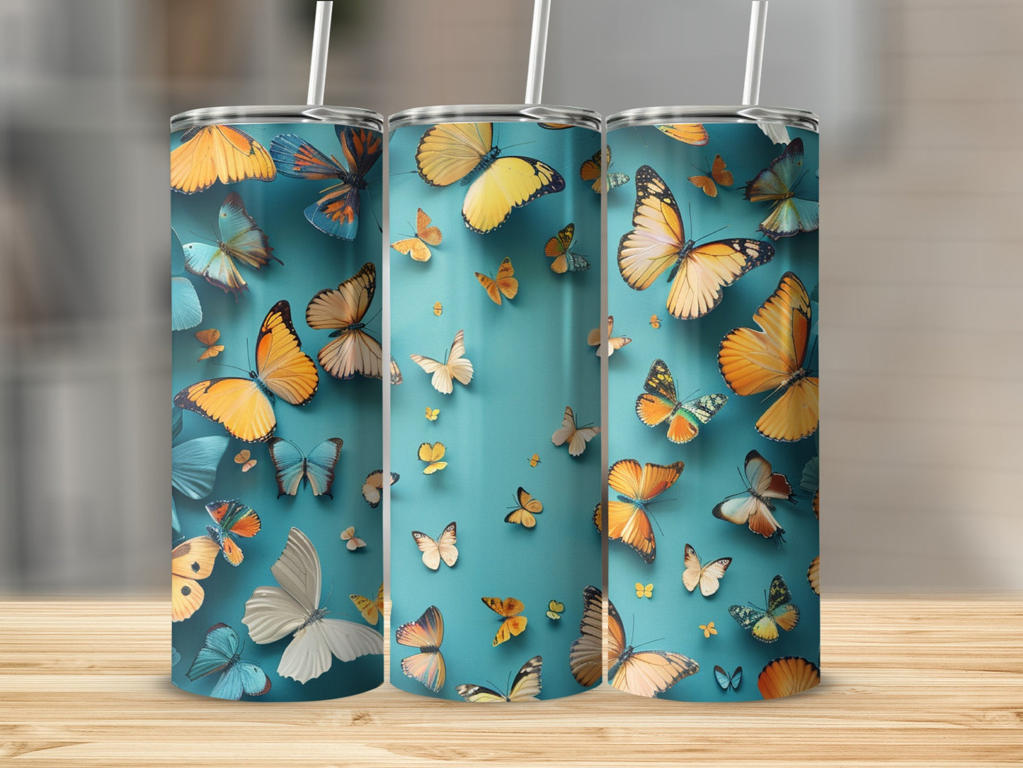 Three tumblers with a teal background featuring colorful butterflies.