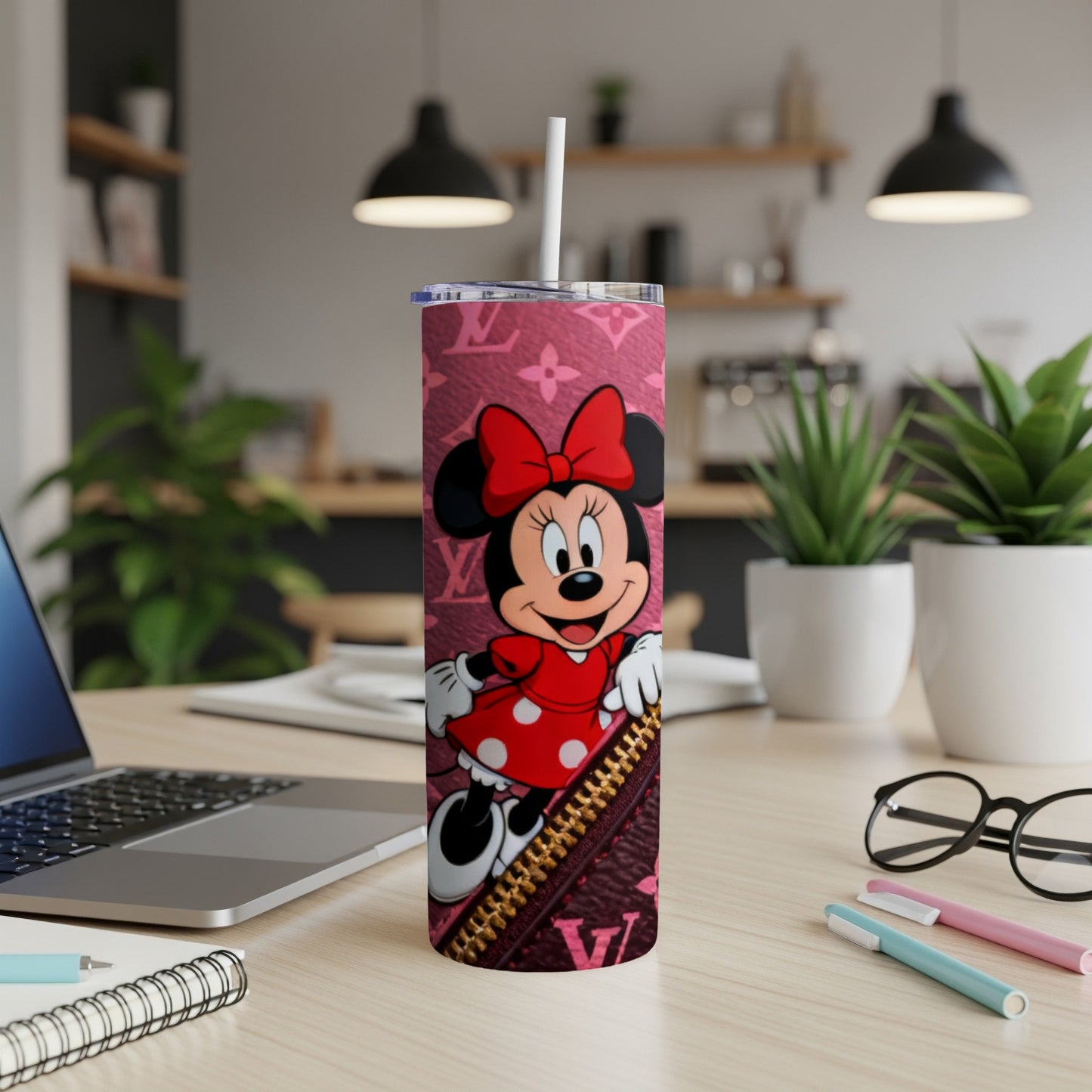 Minnie Mouse on a pink monogram tumbler with a zipper detail.