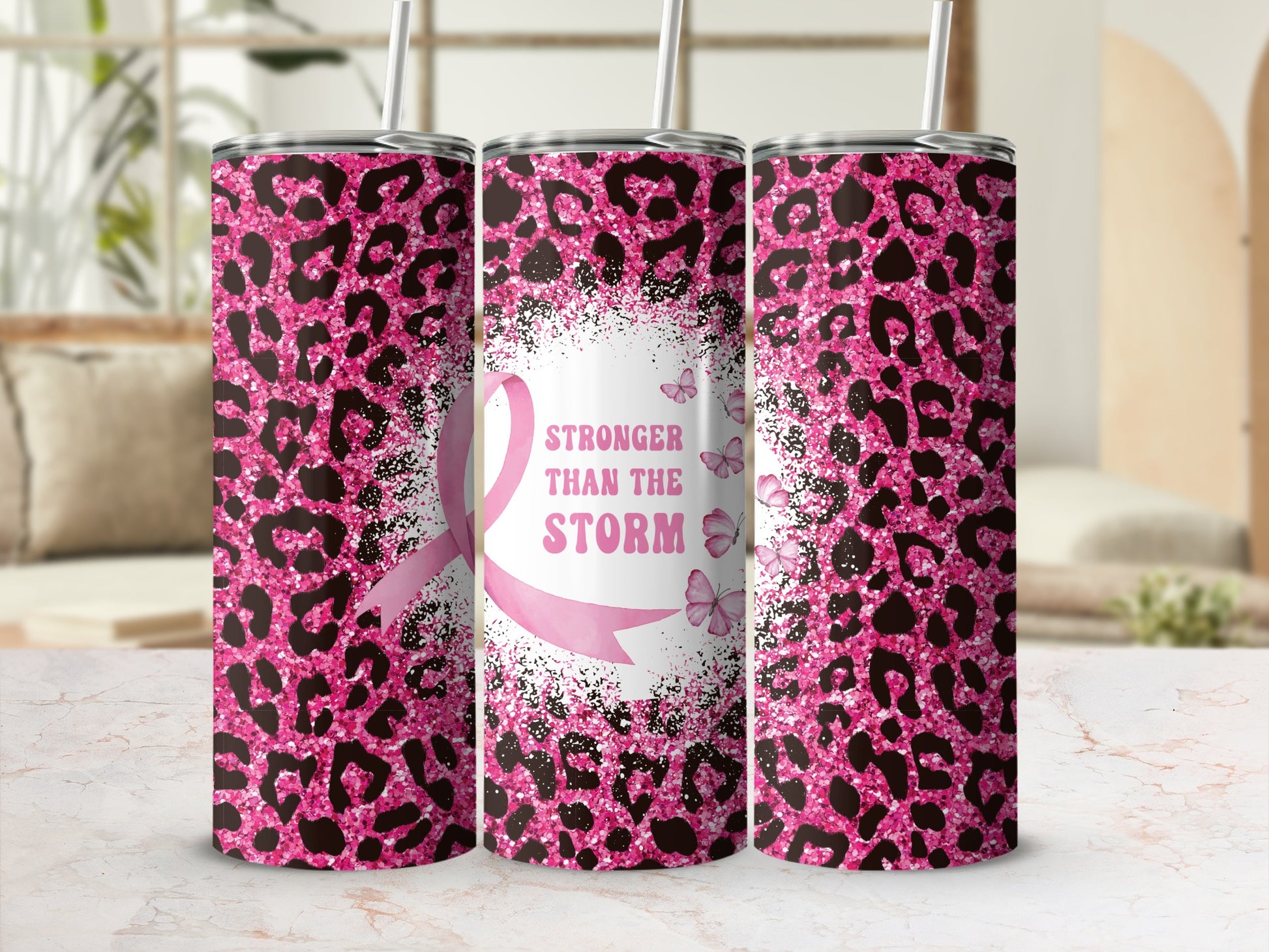Pink leopard print tumbler with "Stronger Than The Storm" and butterflies.