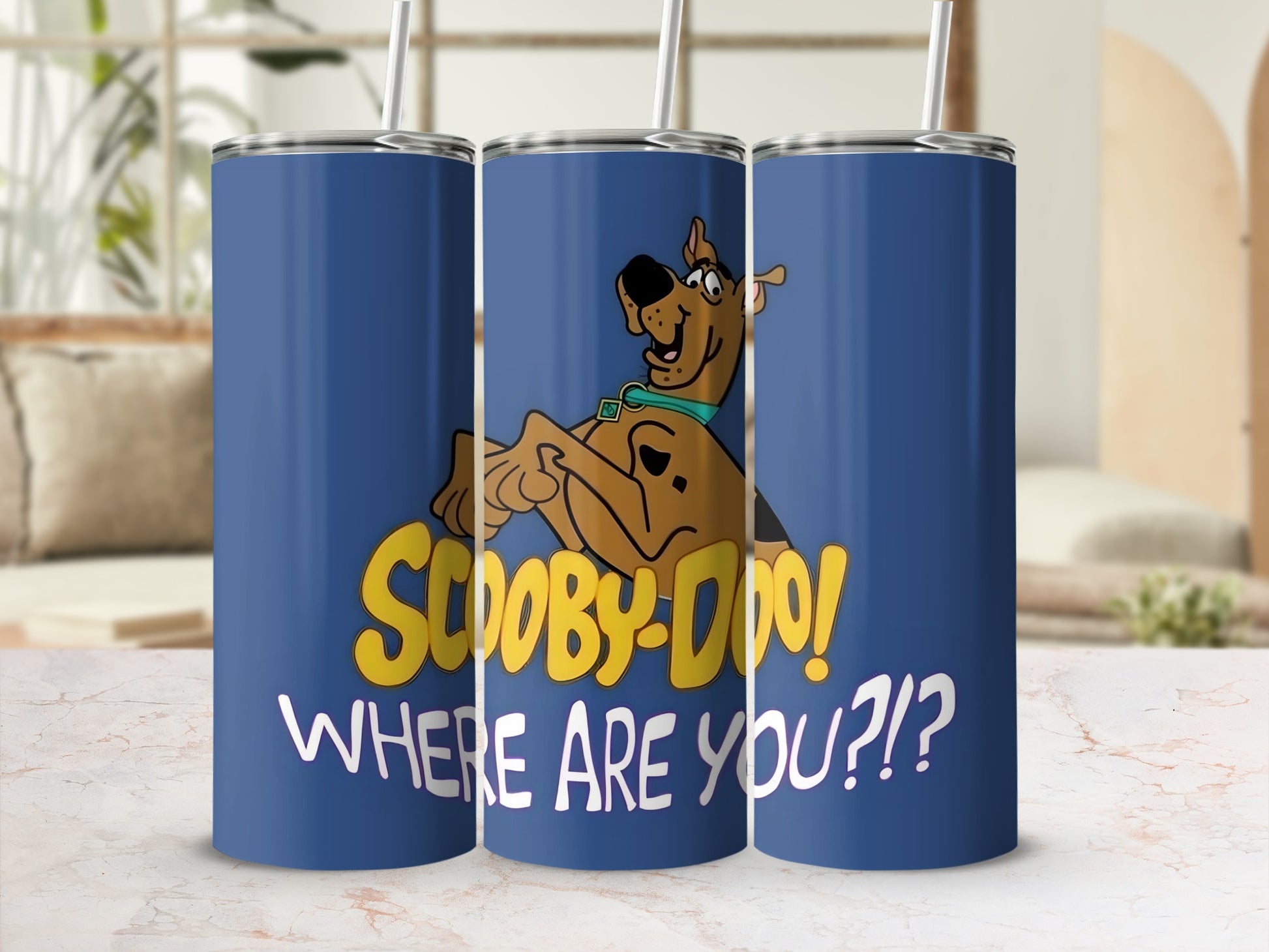 Scooby-Doo! Where are you?! graphic on a blue tumbler with a straw.