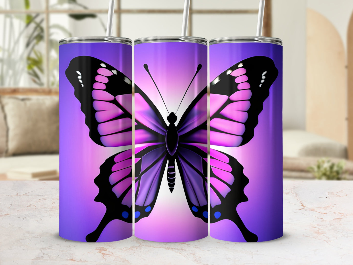 Purple and pink butterfly design on three tall tumblers.