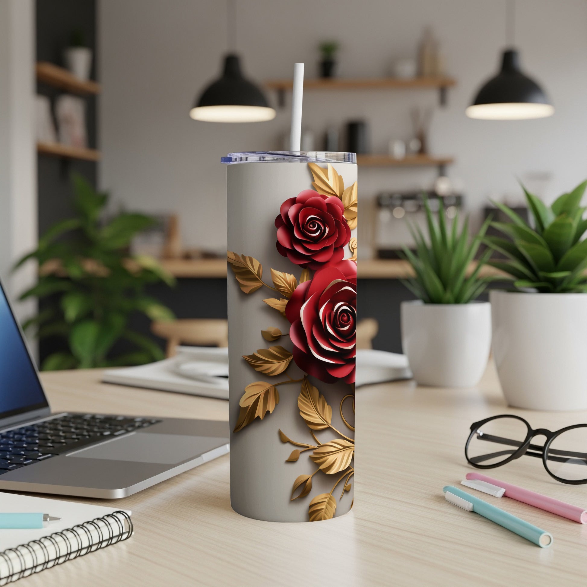 Silver tumbler with red roses and gold leaves design.