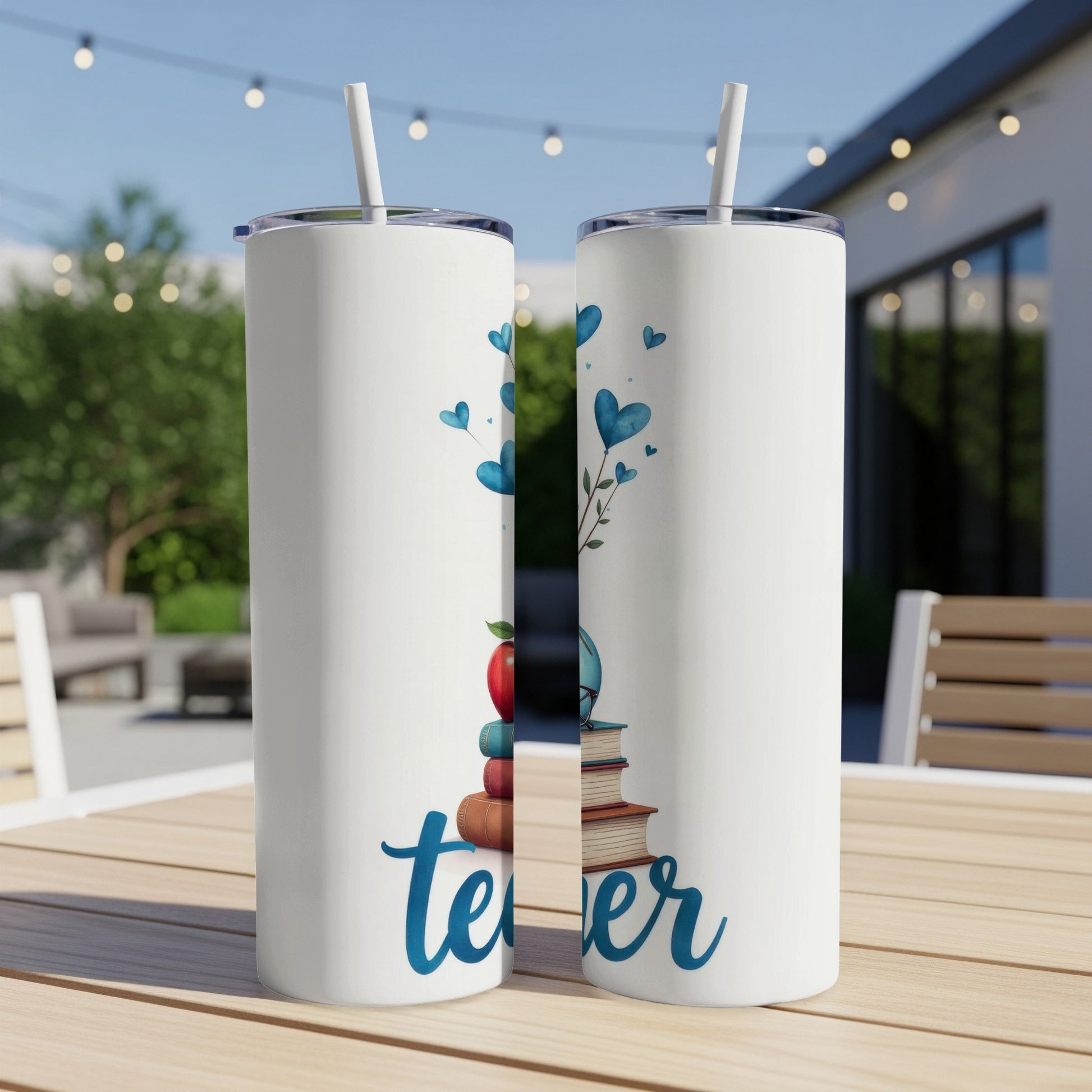Teacher tumbler with apple, books, and blue hearts.