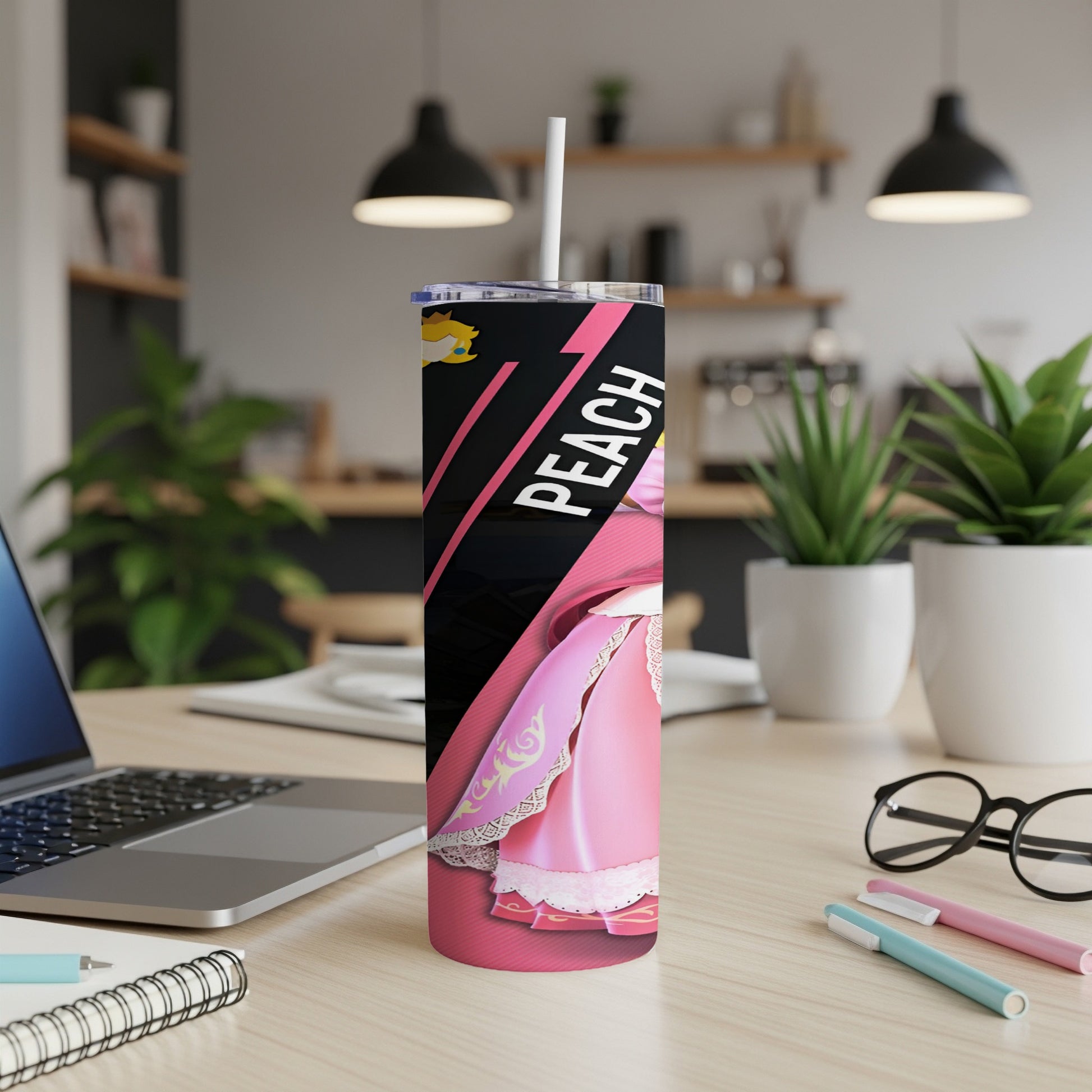Pink tumbler with "Peach" text, a light pink dress, and a white straw.