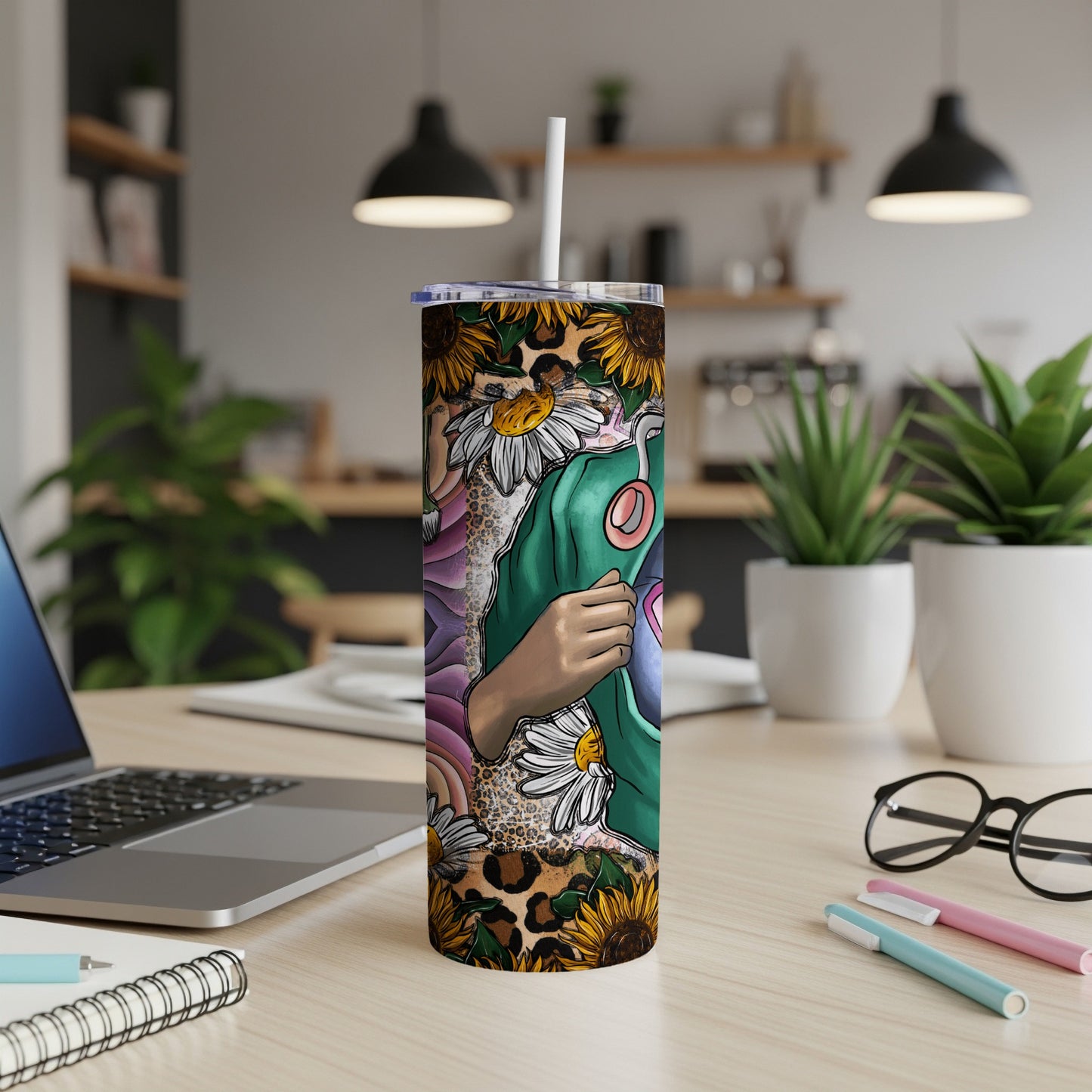 Tumbler with sunflowers, leopard print, and abstract design featuring a hand.