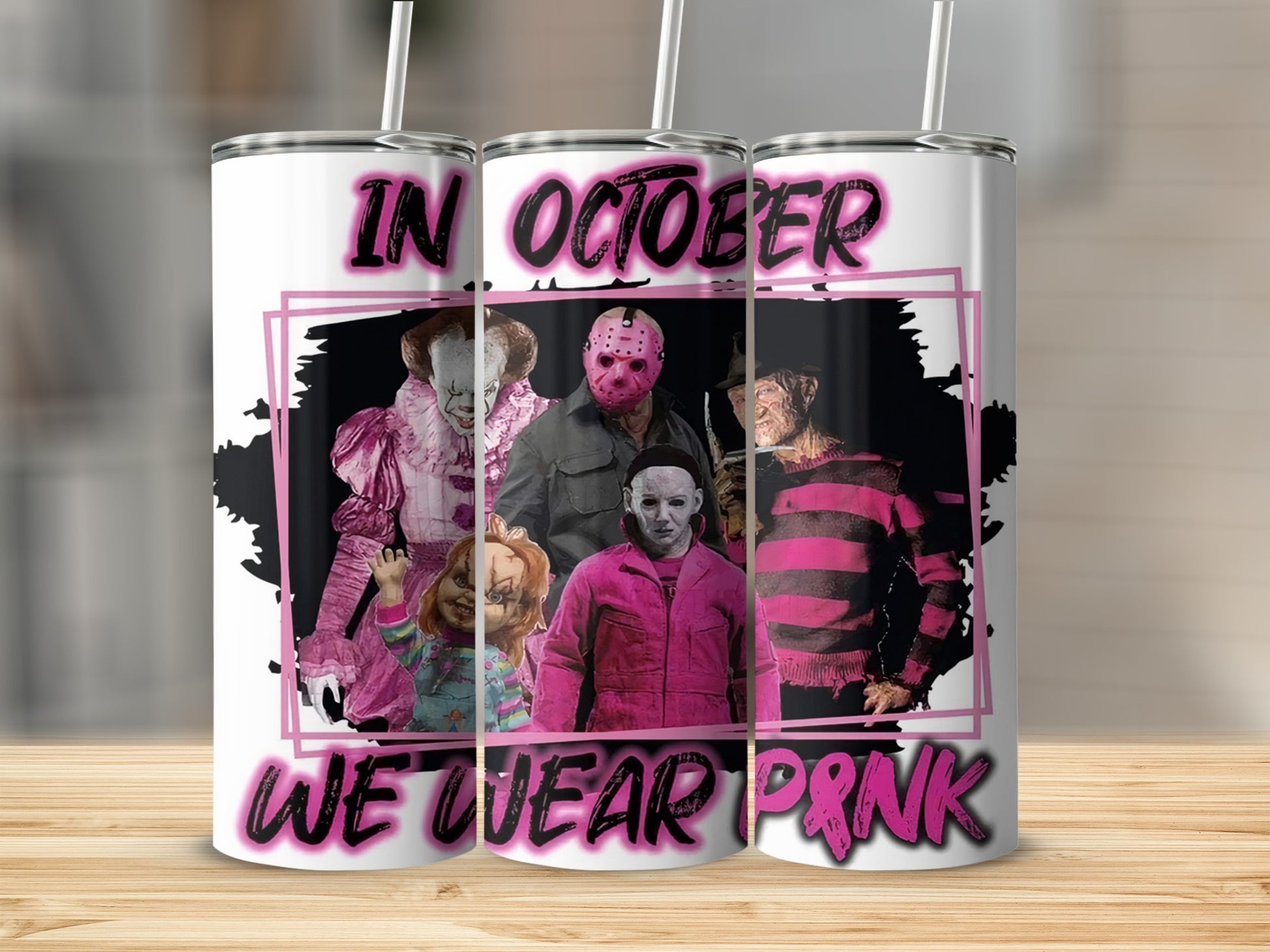 Horror movie villains and text "In October We Wear Pink" on a tumbler.