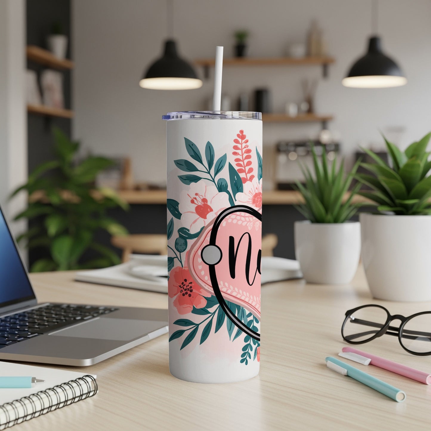 White tumbler with pink floral design and the word "Nurse".