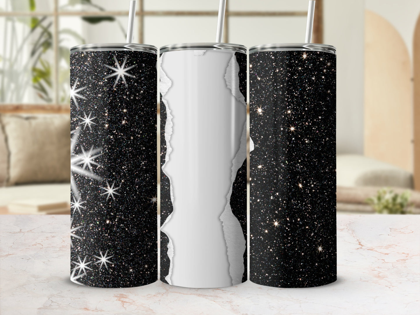 Three sparkly black tumblers with a ripped paper effect on the middle one.
