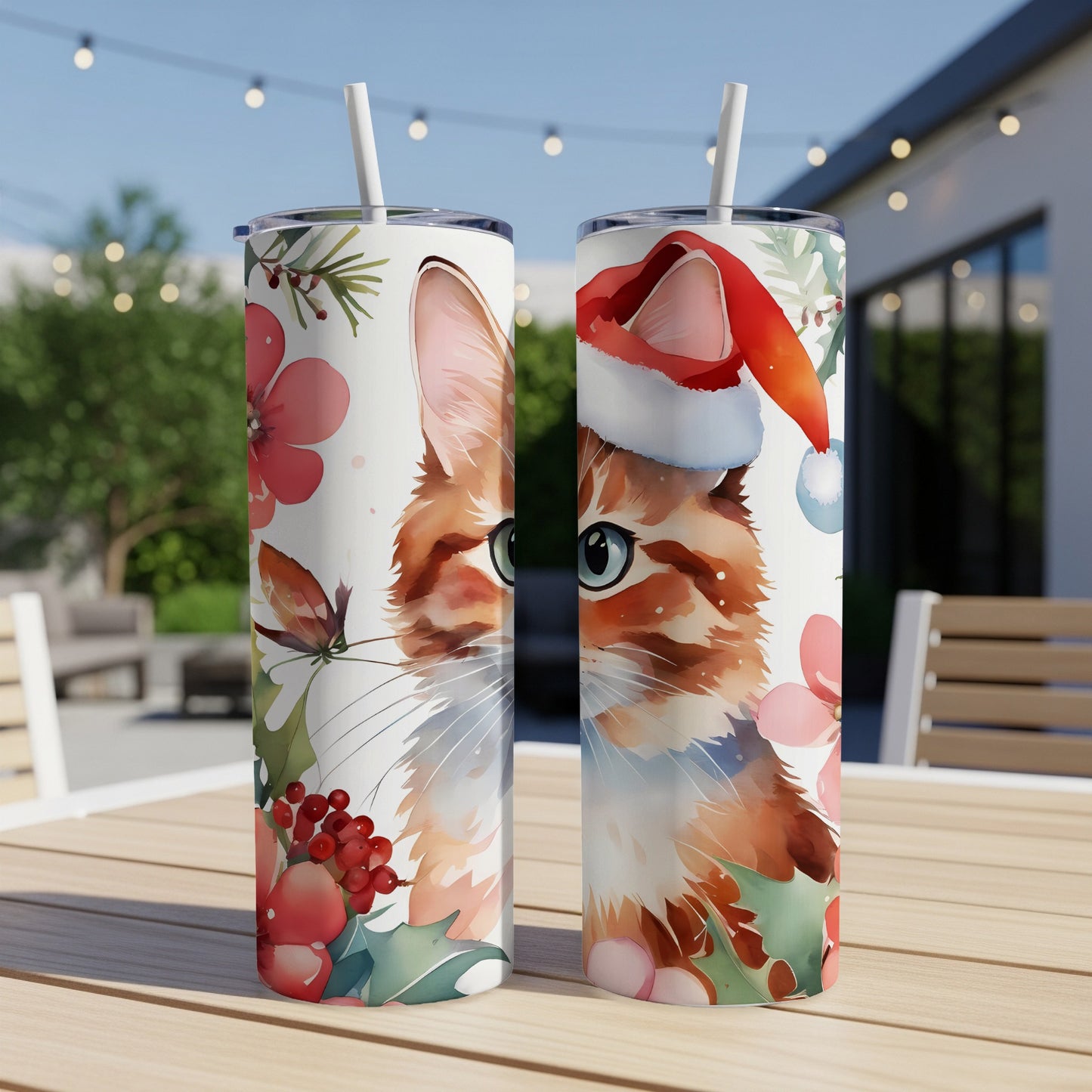 Two tumblers featuring a watercolor cat wearing a Santa hat and festive foliage.