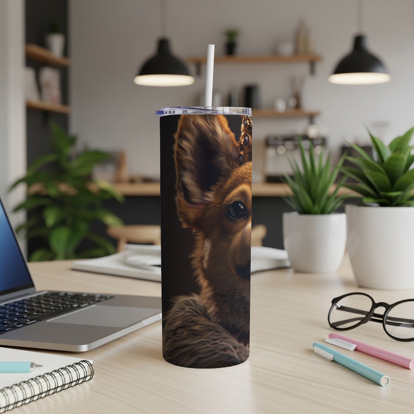 Close-up of a dog's face on a brown tumbler with a straw.