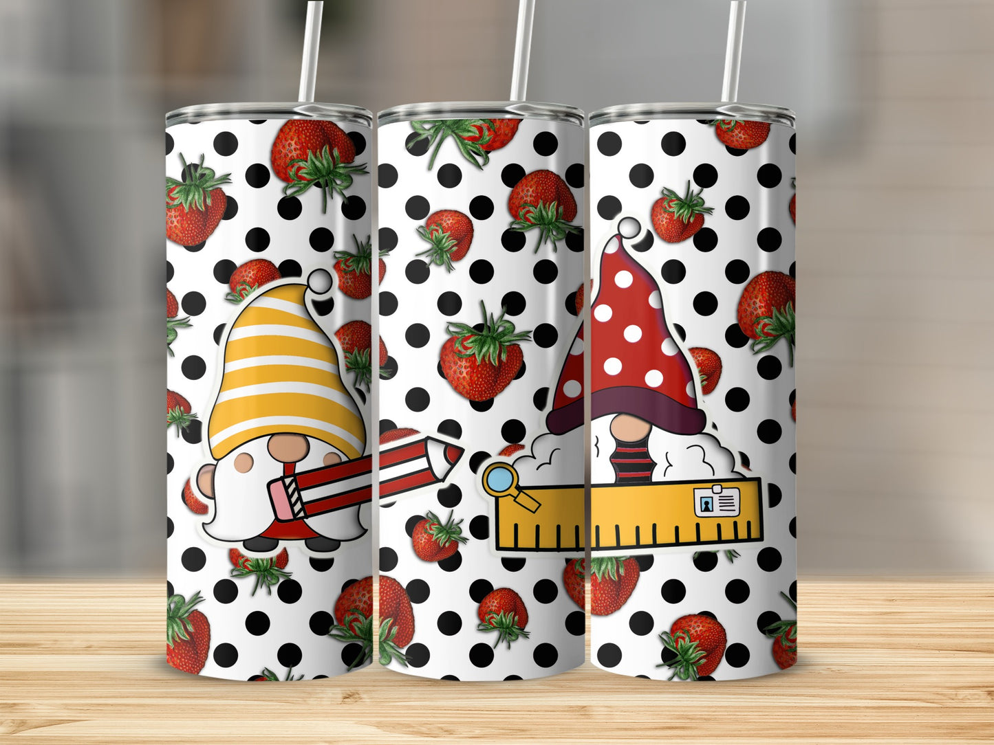 Three tumblers with strawberry and polka dot gnome designs.