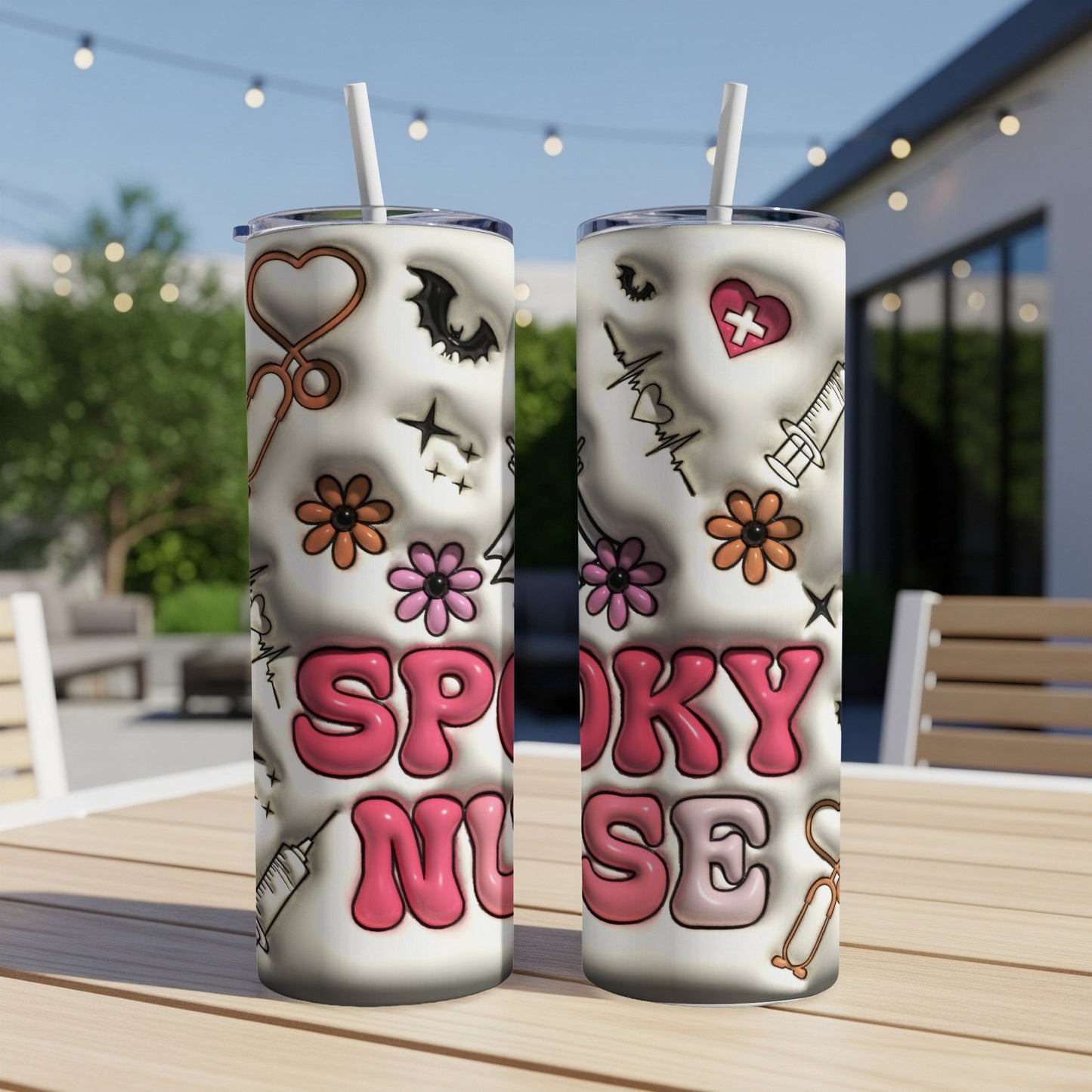 Two "Spooky Nurse" tumblers with Halloween-themed medical icons and flowers.