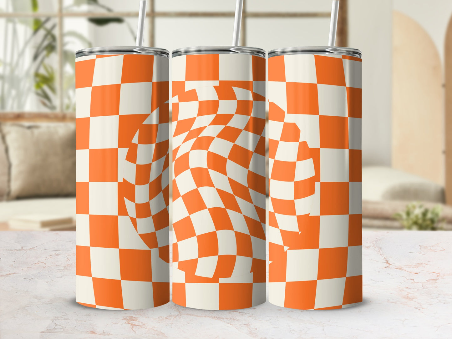Three orange and white checkered tumblers with a warped checkerboard pattern.