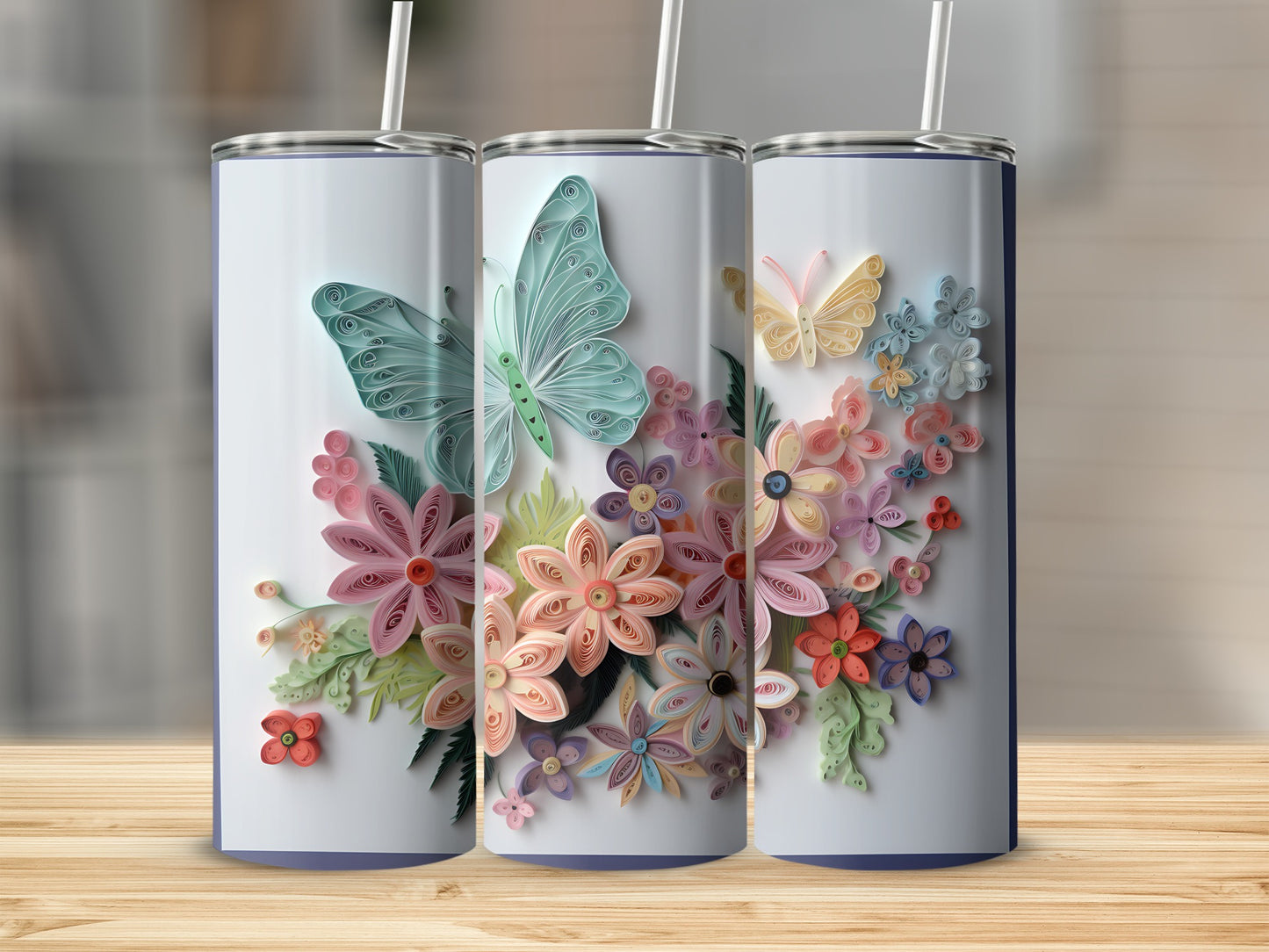 Three tumblers with quilled butterflies and flowers design.