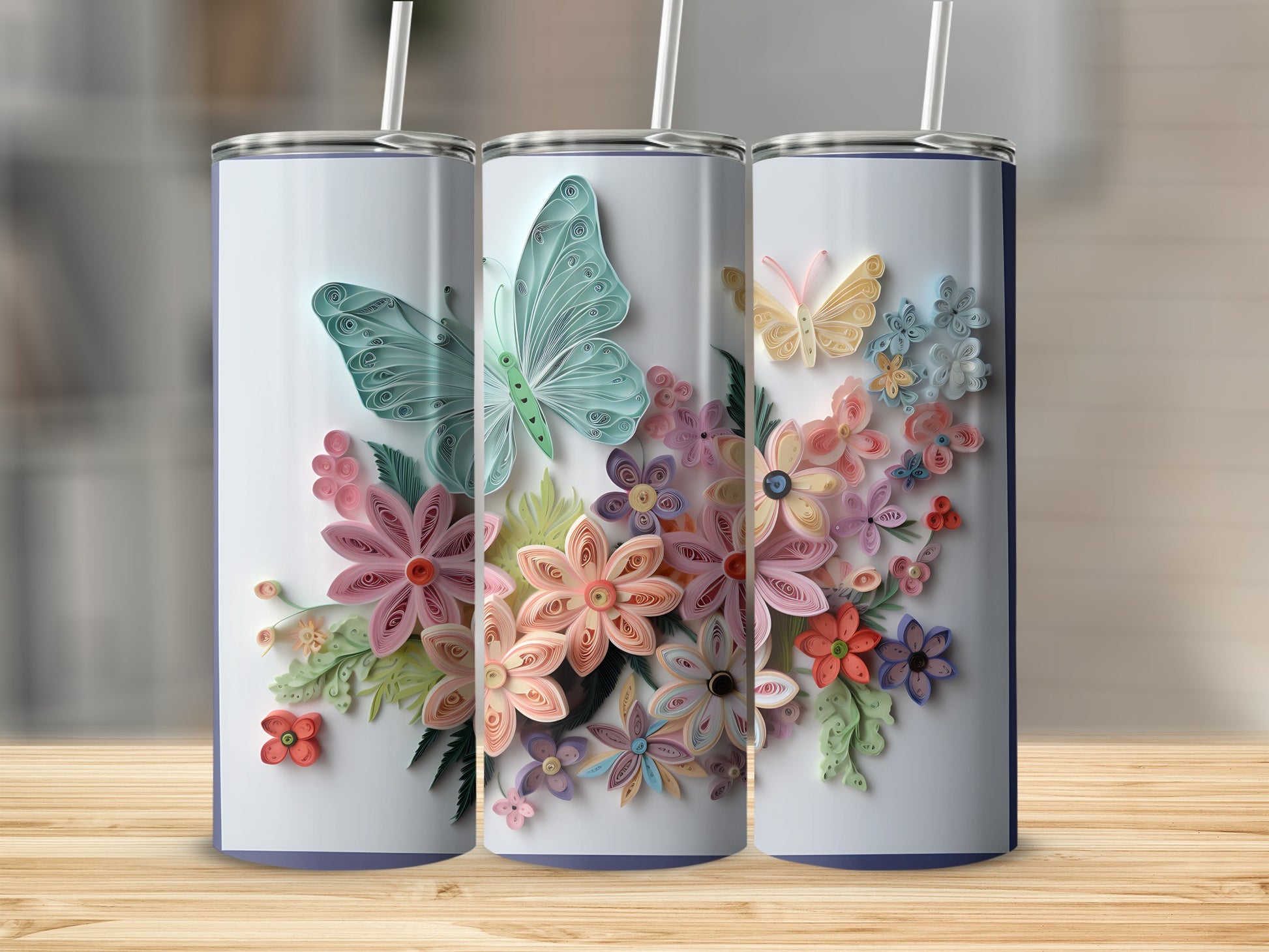 Three tumblers with quilled butterflies and flowers design.