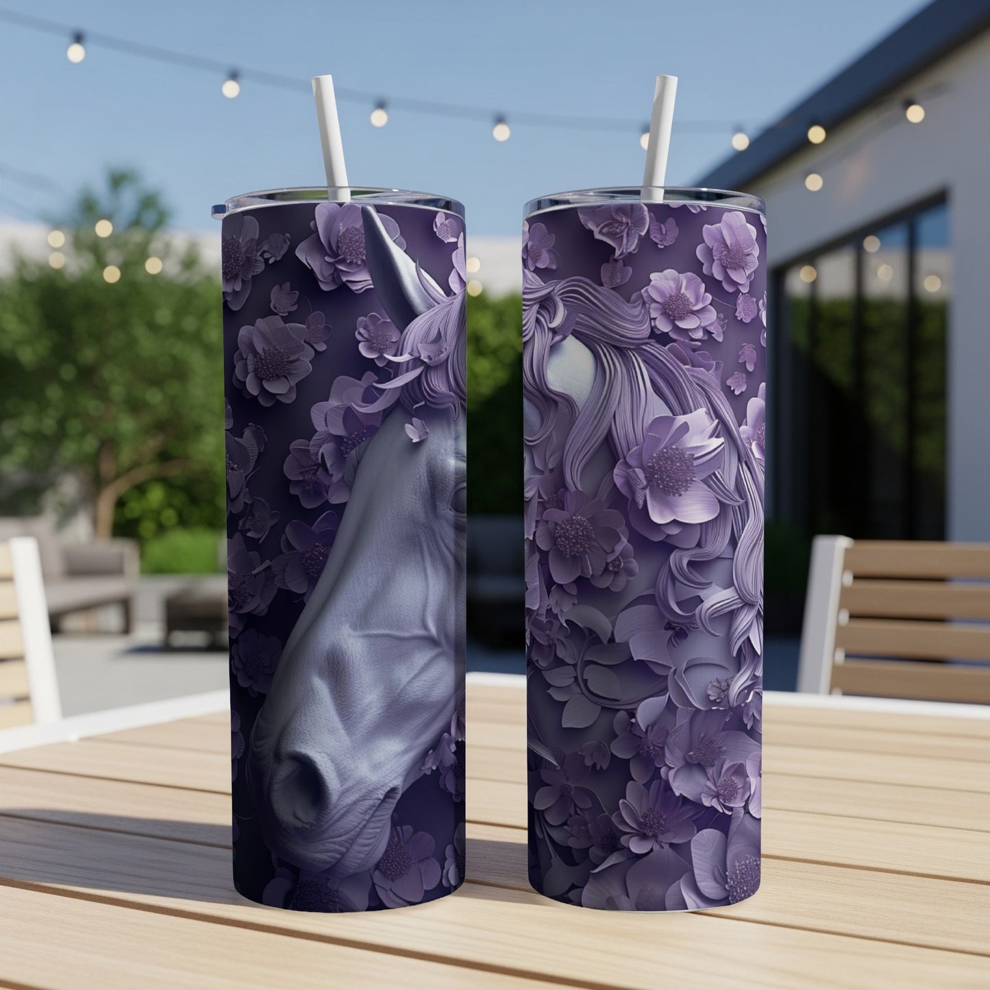 Two purple tumblers with embossed unicorn and floral designs.