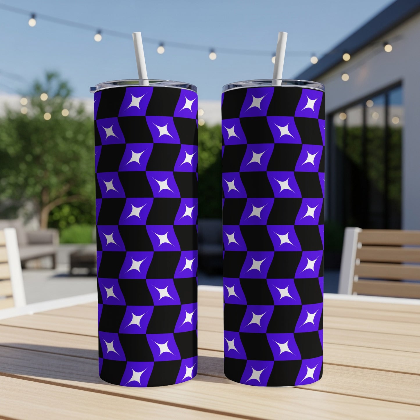 Two tumblers with purple and black geometric star pattern, on a table.