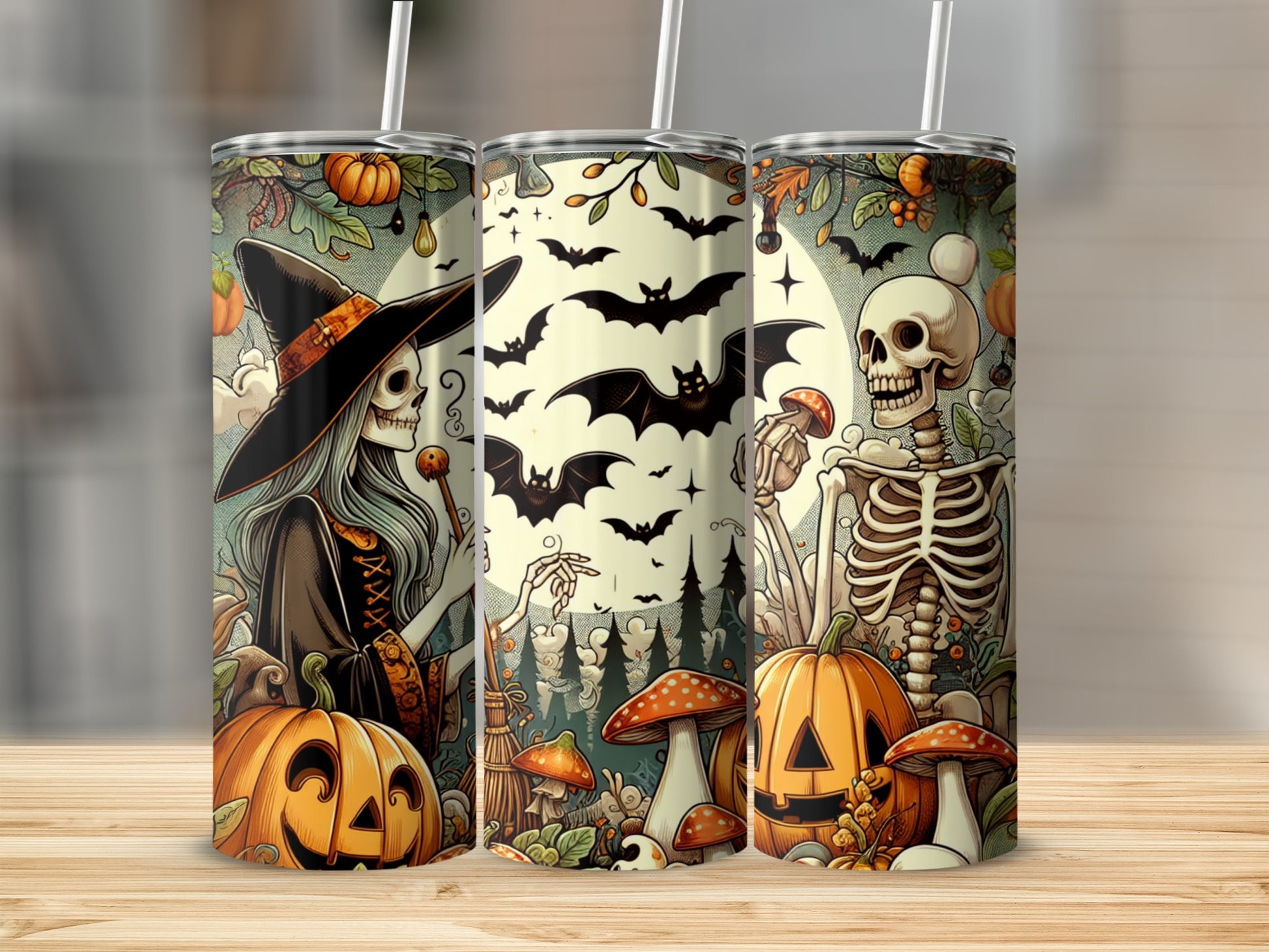 Three tumblers with Halloween art of a witch skeleton, bats, pumpkins, and mushrooms.