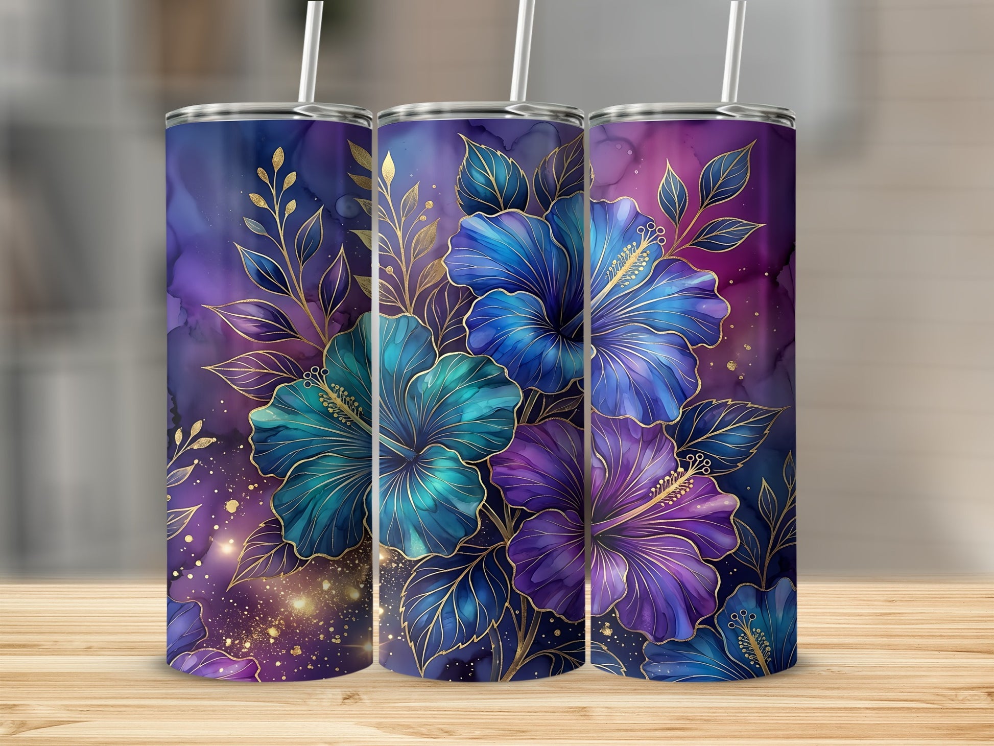 Three tumblers with teal and purple hibiscus flowers and gold accents.