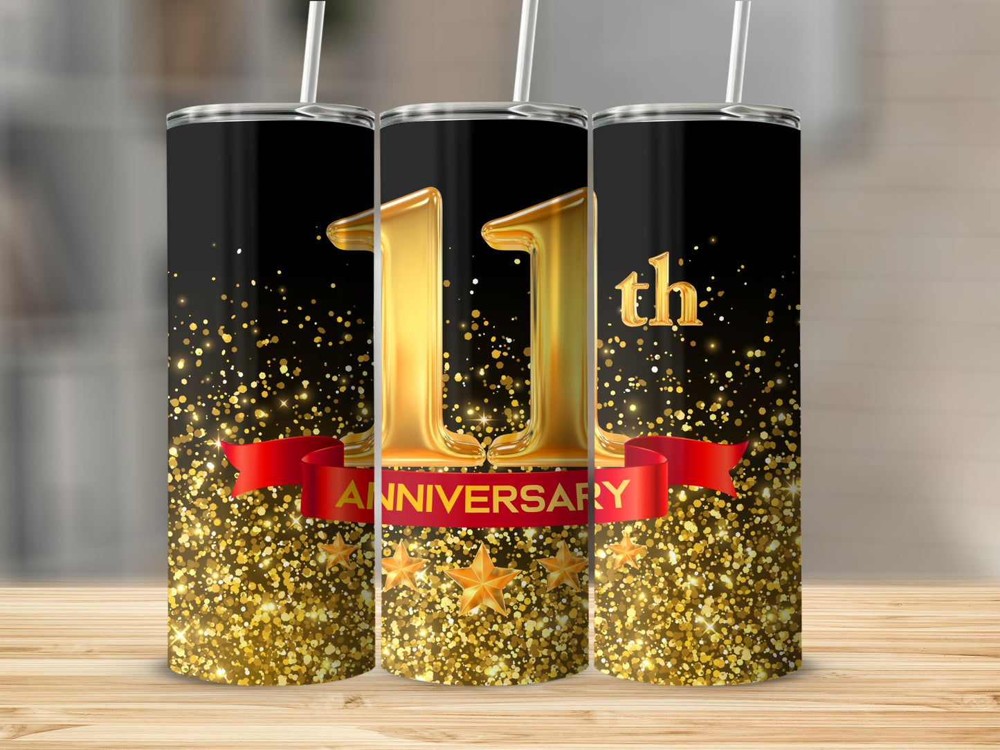 Gold 11th Anniversary tumbler with red ribbon and glittering stars on black.