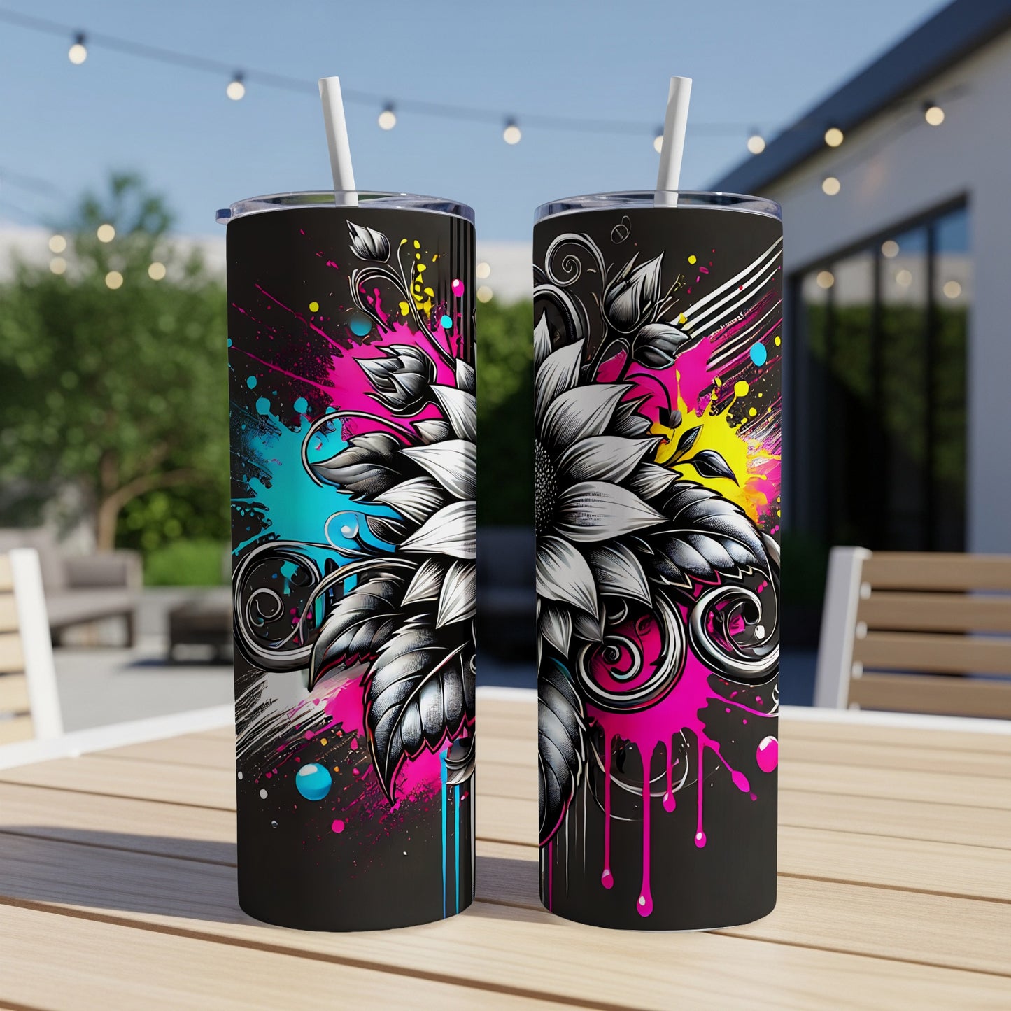 Two tumblers with a black background and colorful paint splatters, featuring a floral design.