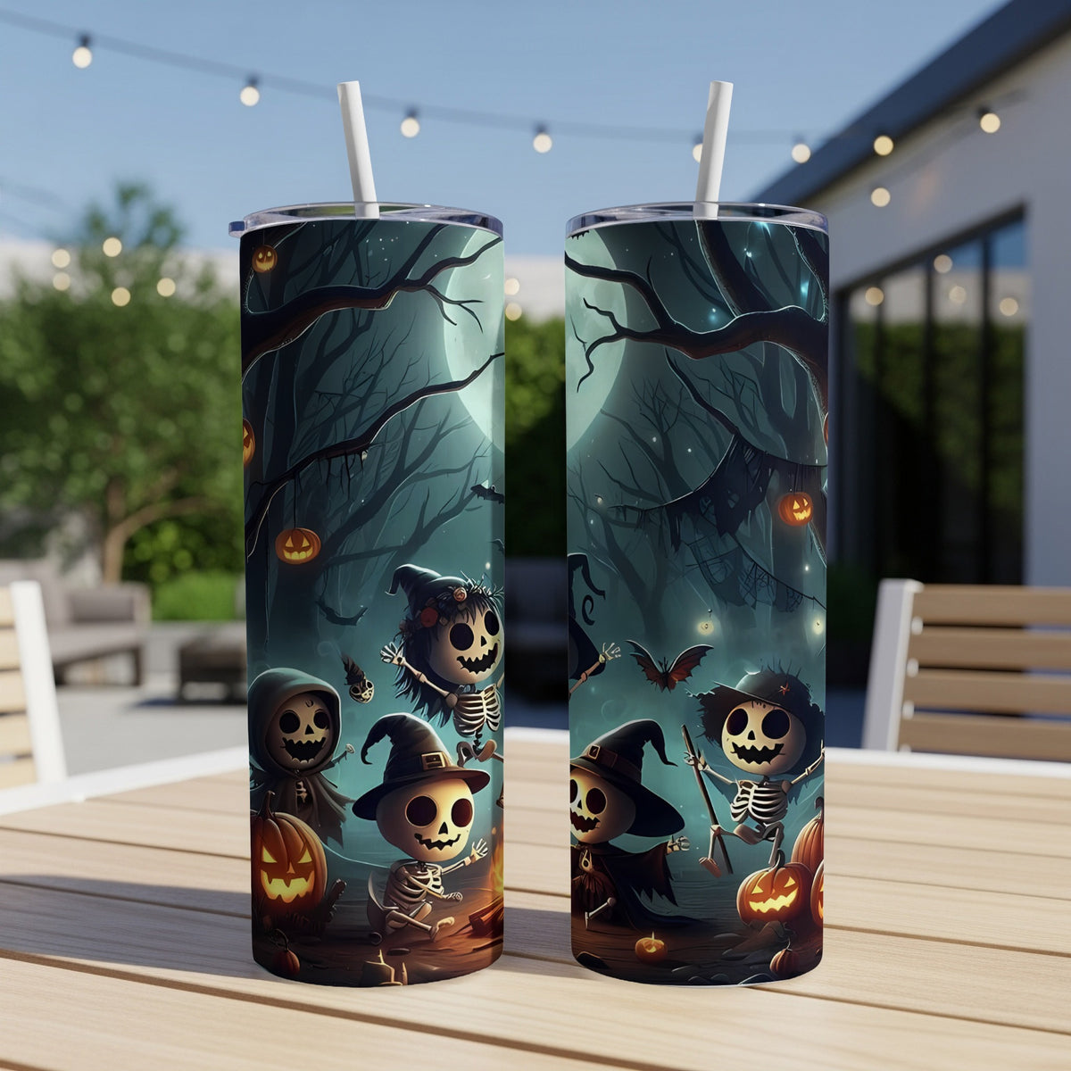 Two tumblers with a spooky Halloween scene featuring skeletons, pumpkins, and bats.