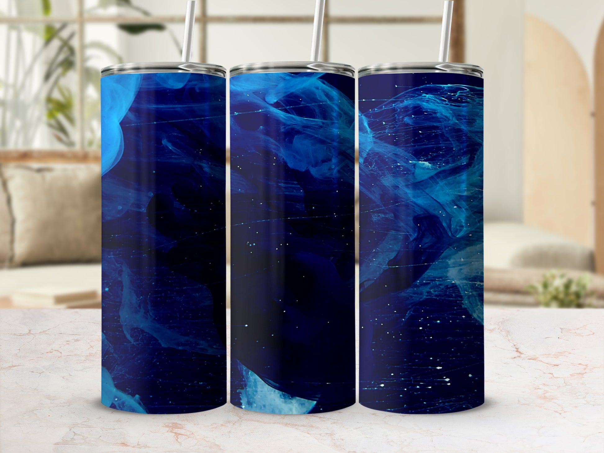 Three tumblers with swirling blue abstract design and white speckles.
