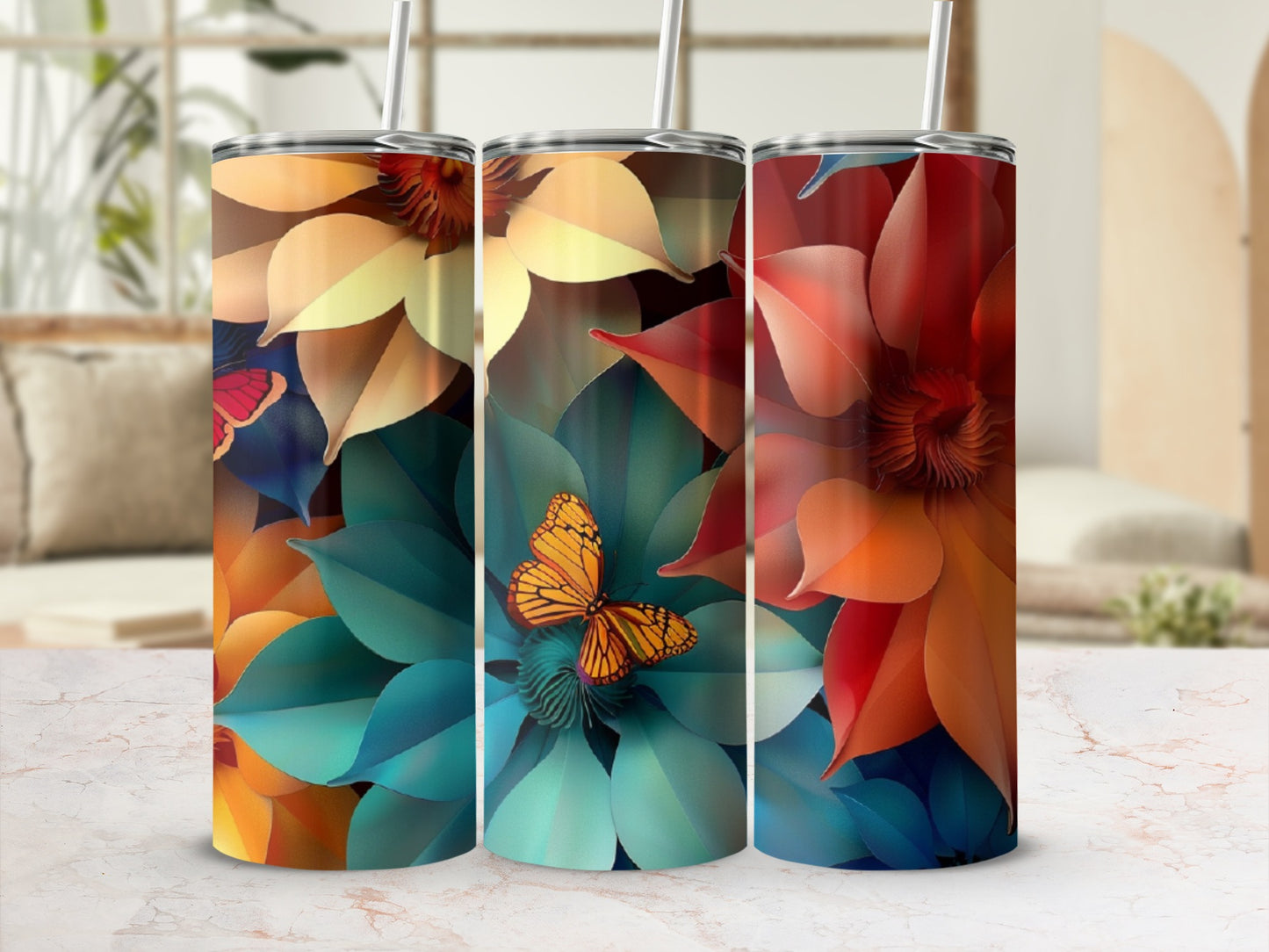 Three tumblers with floral and butterfly designs in warm, vibrant colors.