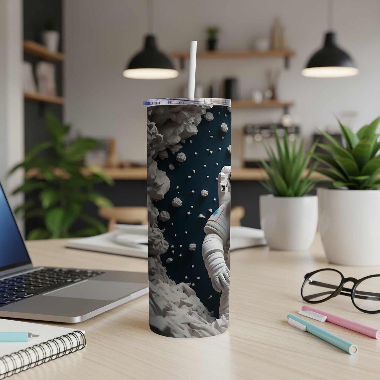 Astronaut in space pattern on a tall tumbler with a straw.