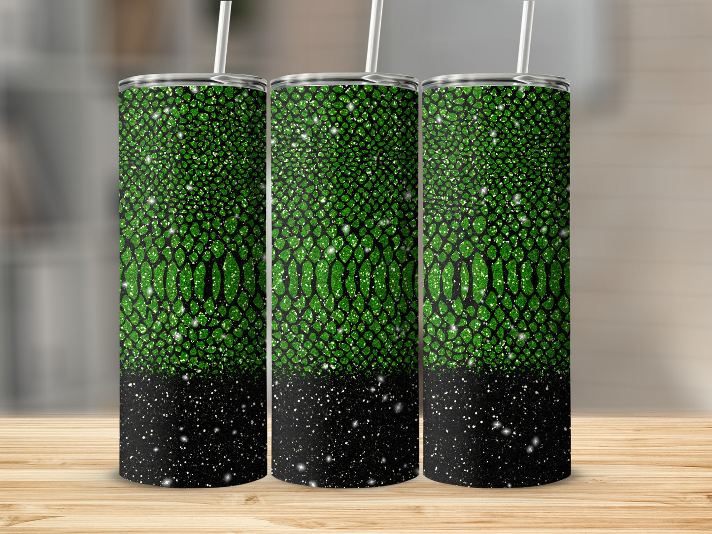 Three tumblers with green reptile skin and black glitter patterns.