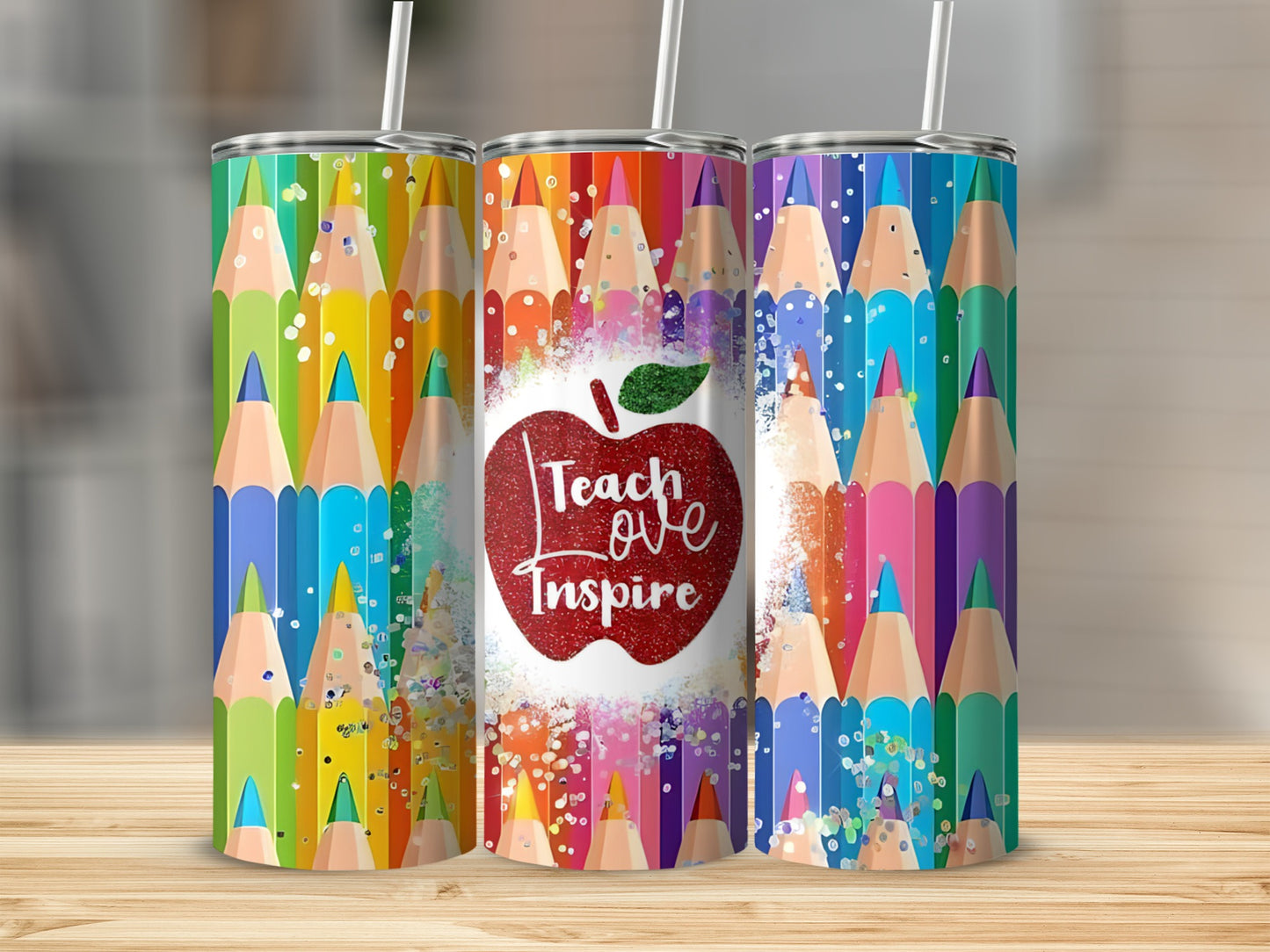 Tumbler with colorful pencils and "Teach Love Inspire" apple design.