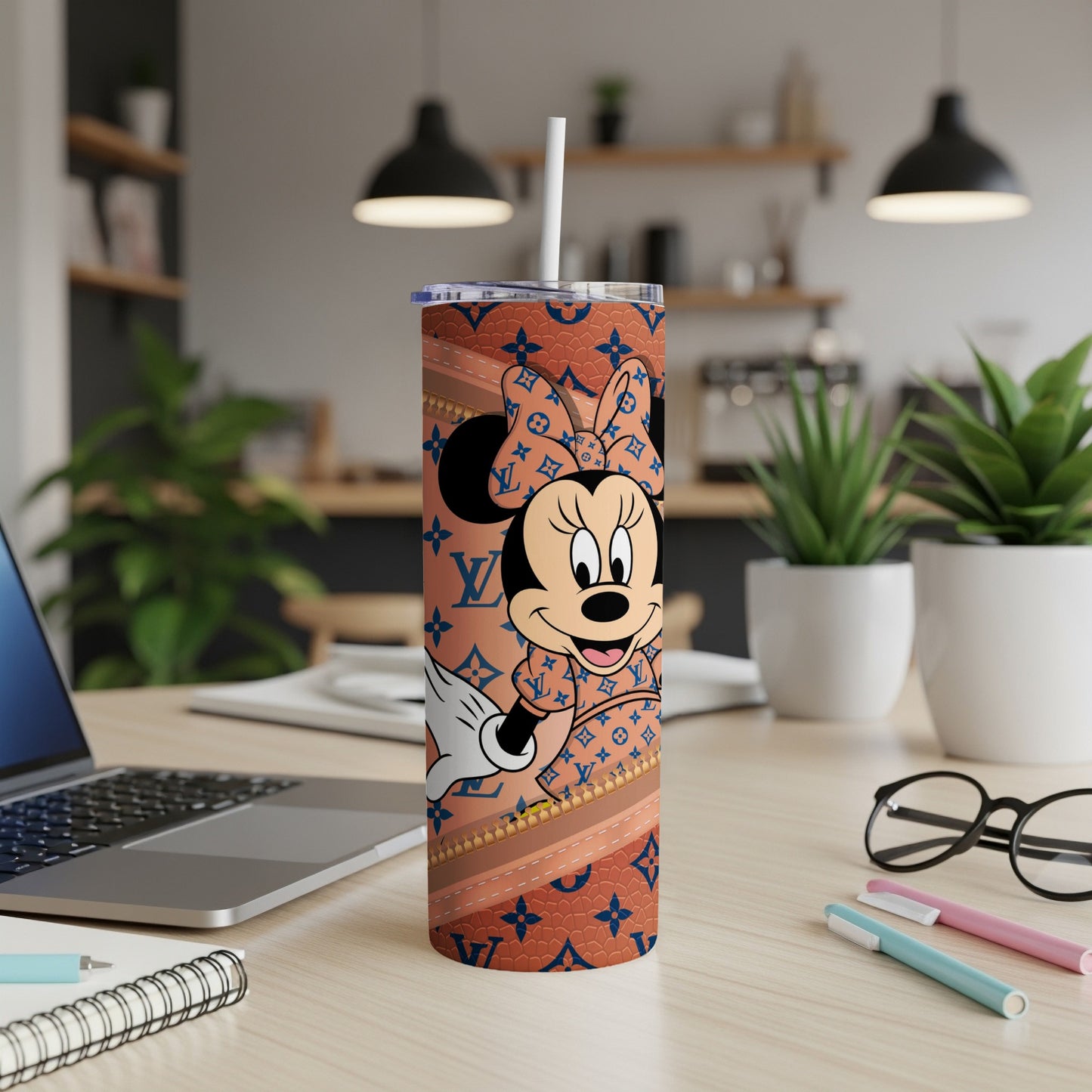 Minnie Mouse on a brown tumbler with a repeating LV-inspired pattern.