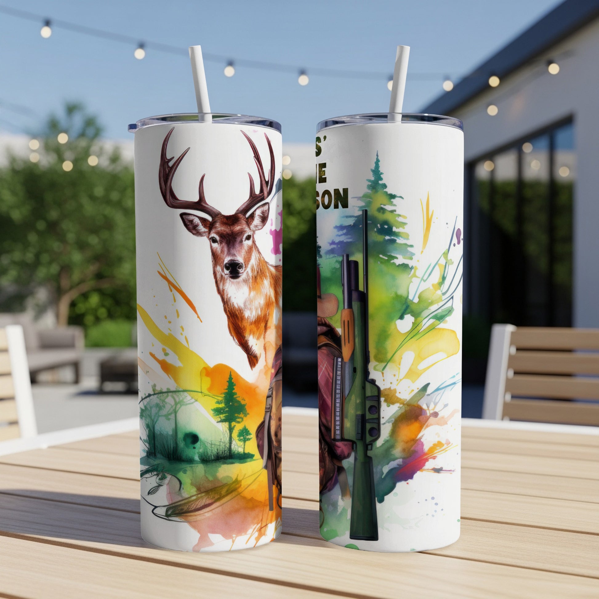 Deer and hunter design on two tumblers with straws.