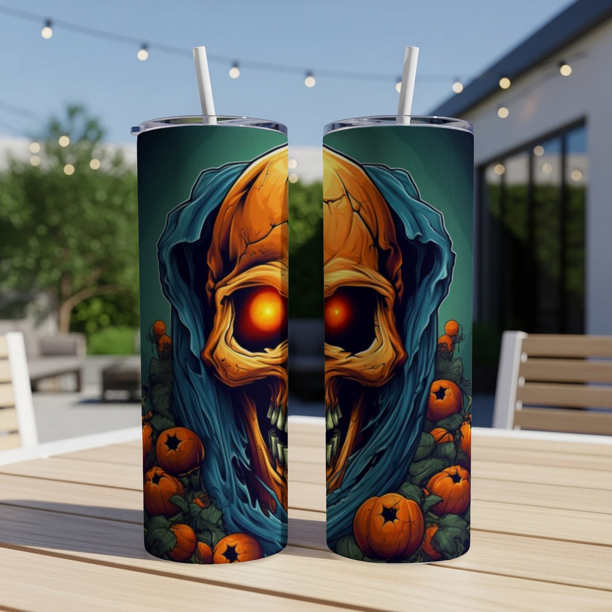 Two tumblers featuring a Halloween skull with glowing eyes and pumpkins.