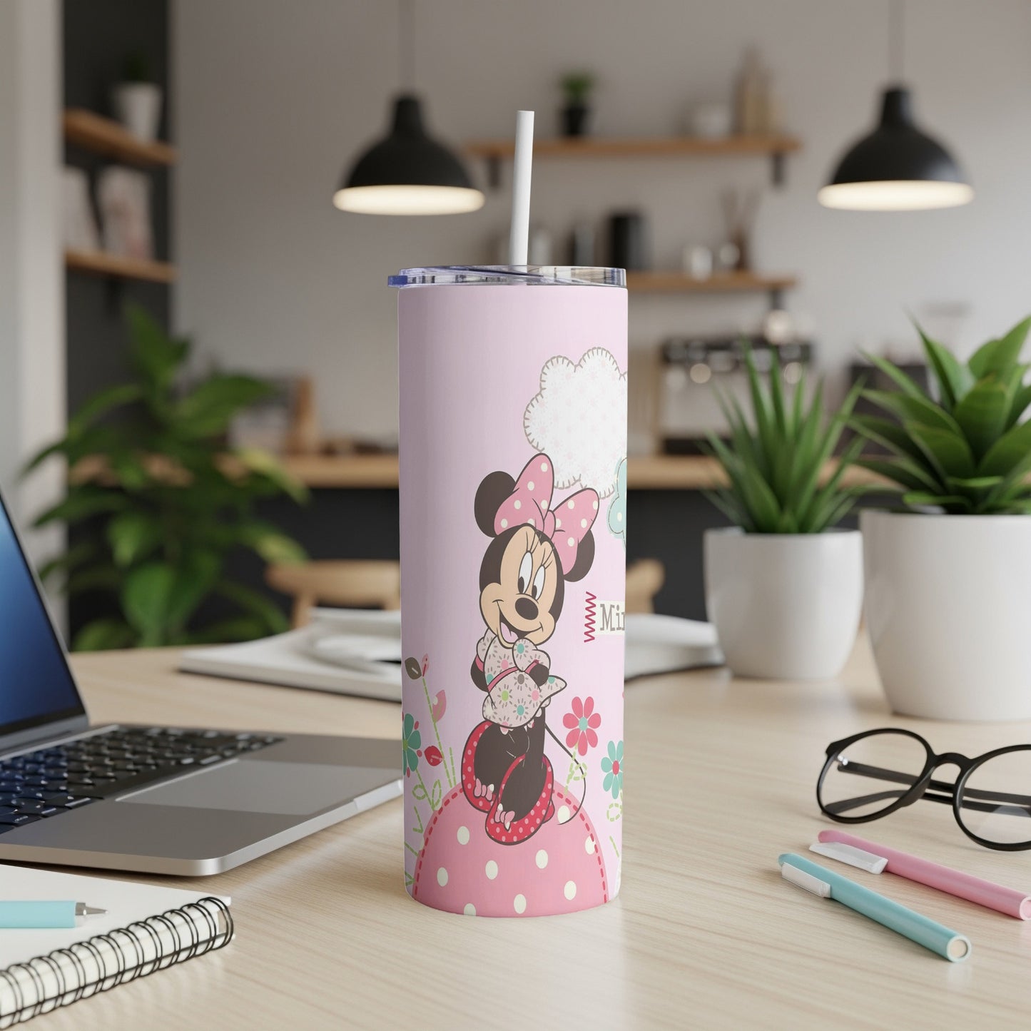 Pink tumbler with Minnie Mouse in a floral dress and bow.