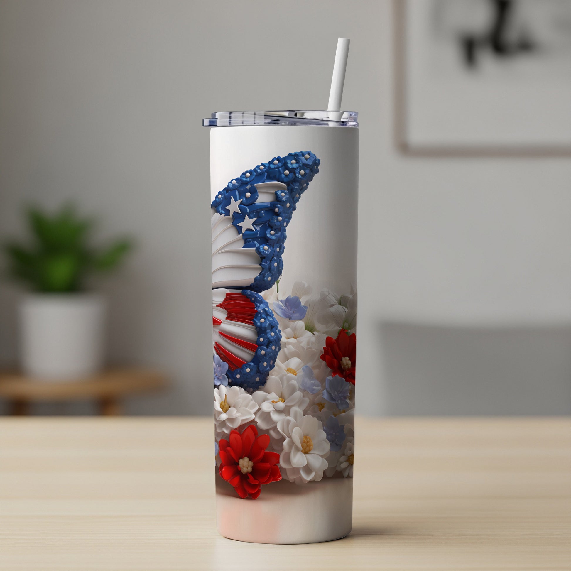 Tumbler with patriotic butterfly and floral design.