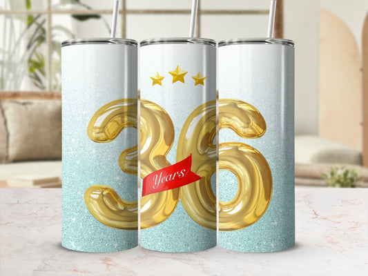 Three tumblers with large gold "36" design and sparkly background.