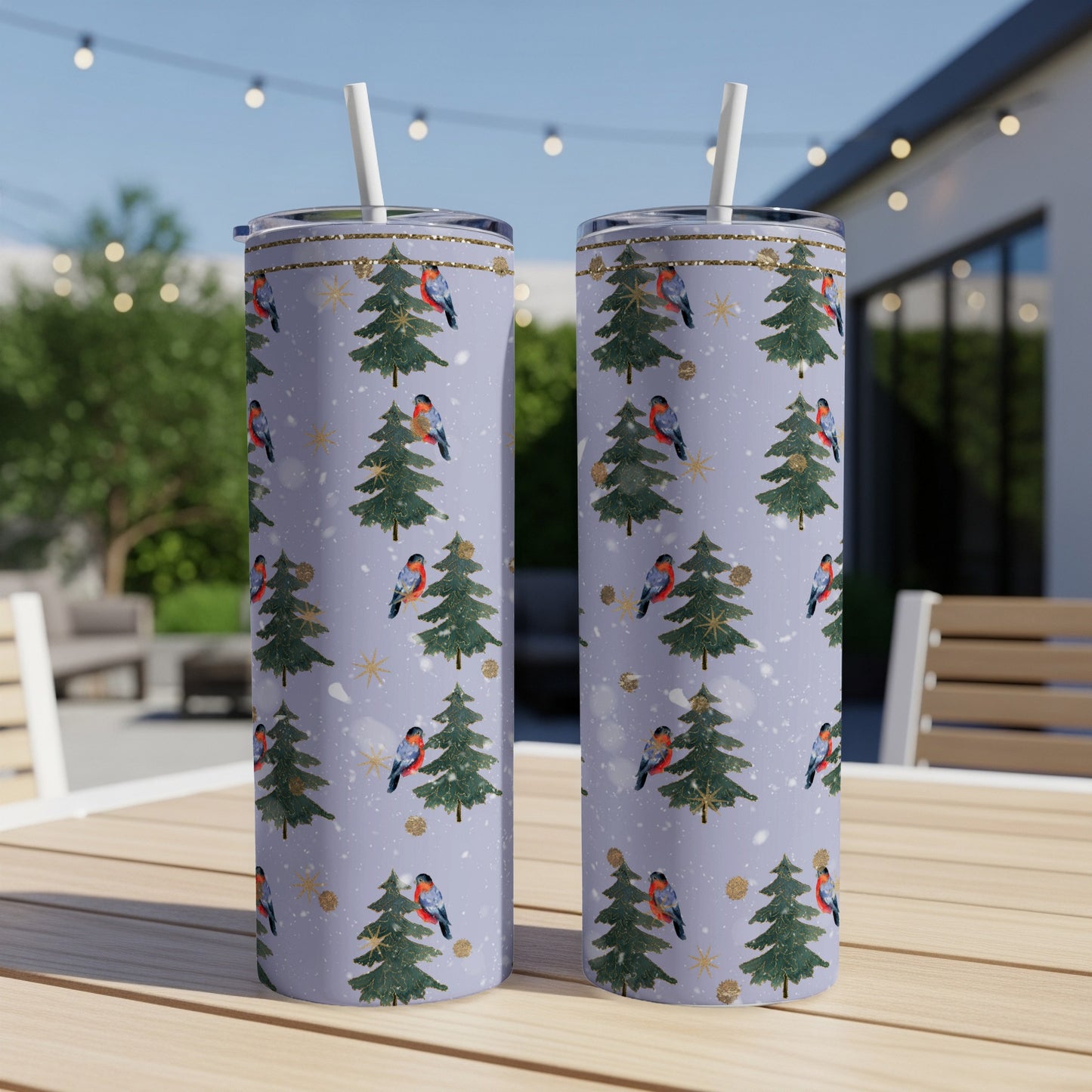 Purple tumbler with a Christmas tree and bird pattern.